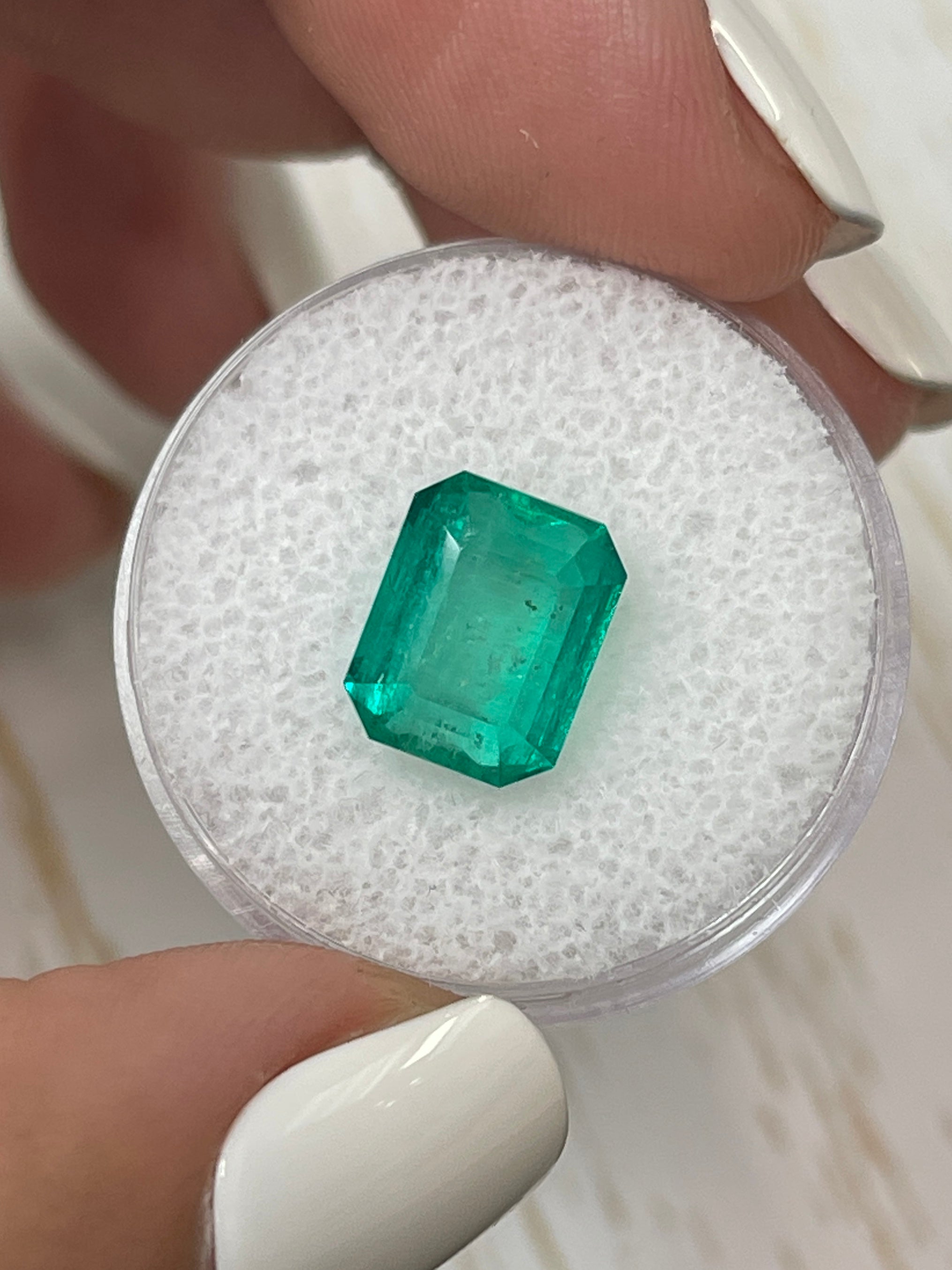 5.11 carat green natural Colombian emerald in an emerald cut, loose gemstone from JR Colombian Emeralds.