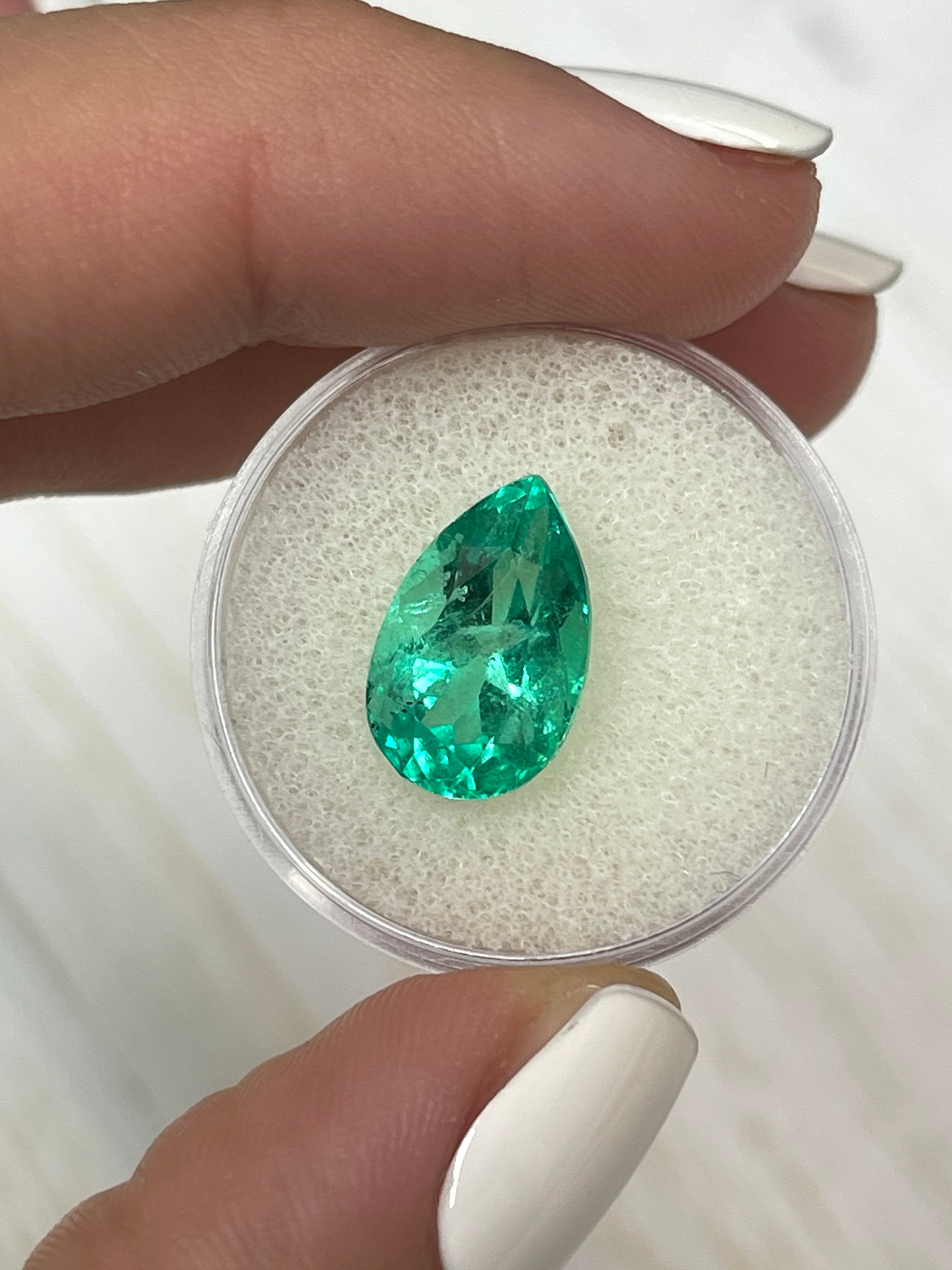 Vivid 5.21 carat Colombian emerald loose gemstone with pear cut, measuring 14.3x9mm, from JR Colombian Emeralds.