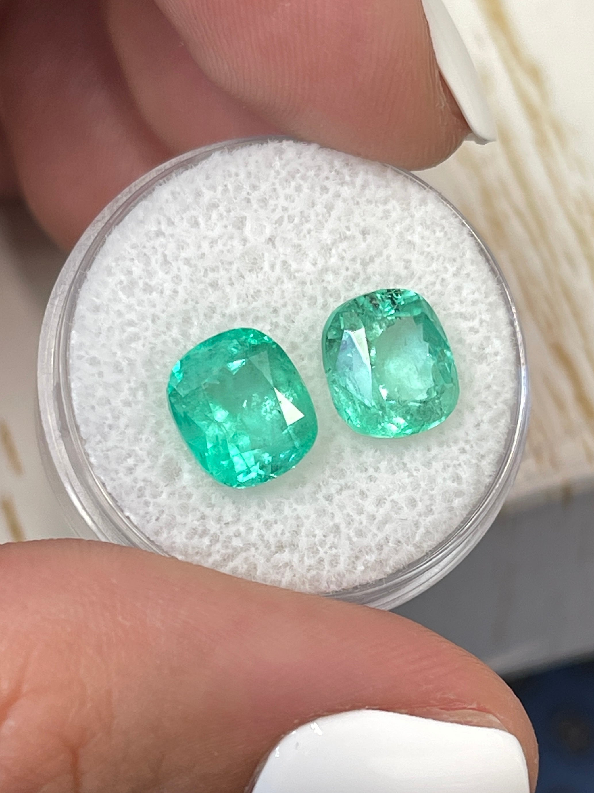 Light bluish green Colombian emeralds, 5.61 carats total, cushion cut, natural loose gemstones from JR Colombian Emeralds.