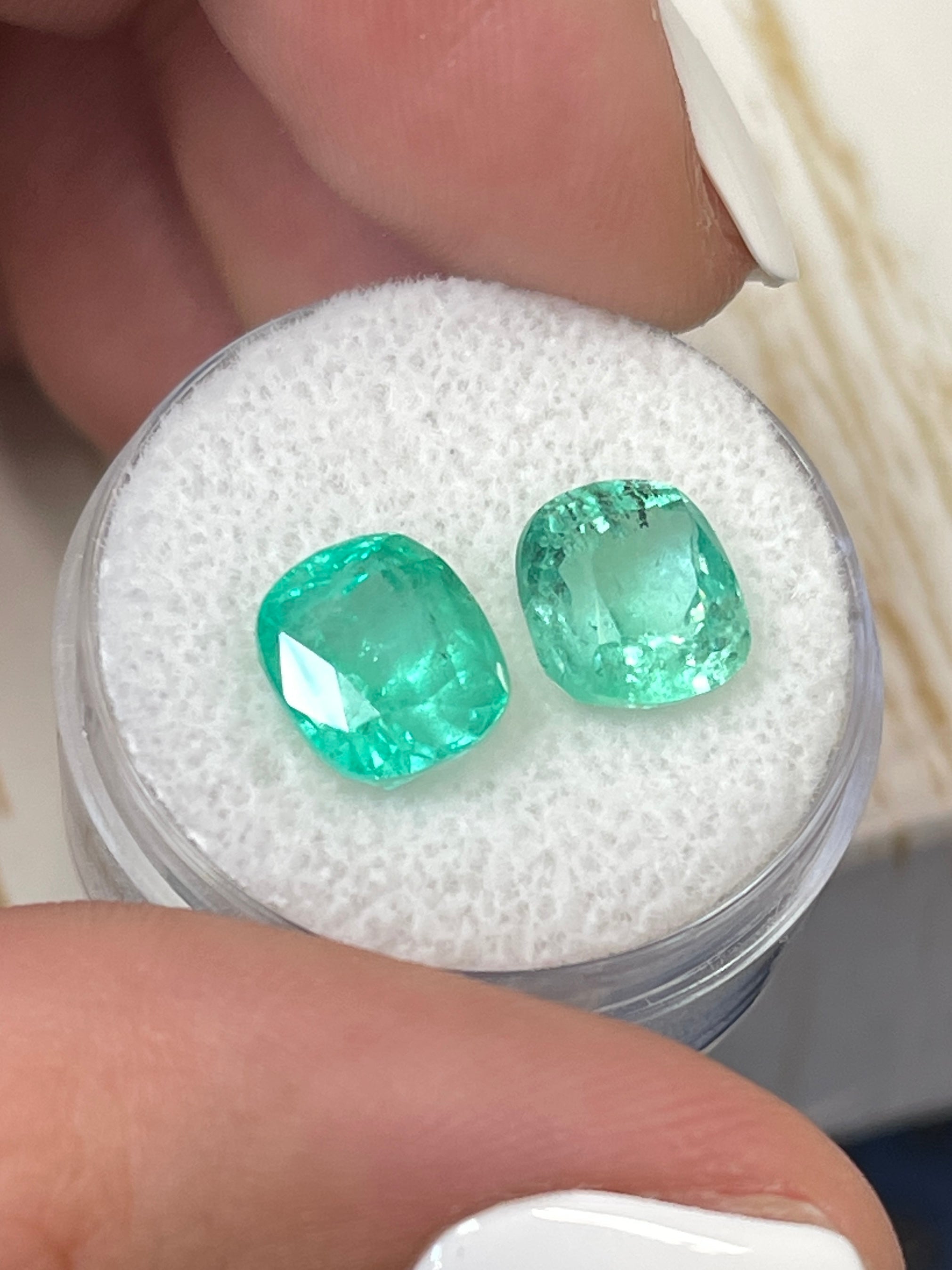Light bluish green Colombian emeralds, 5.61 carats total, cushion cut, natural loose gemstones by JR Colombian Emeralds.