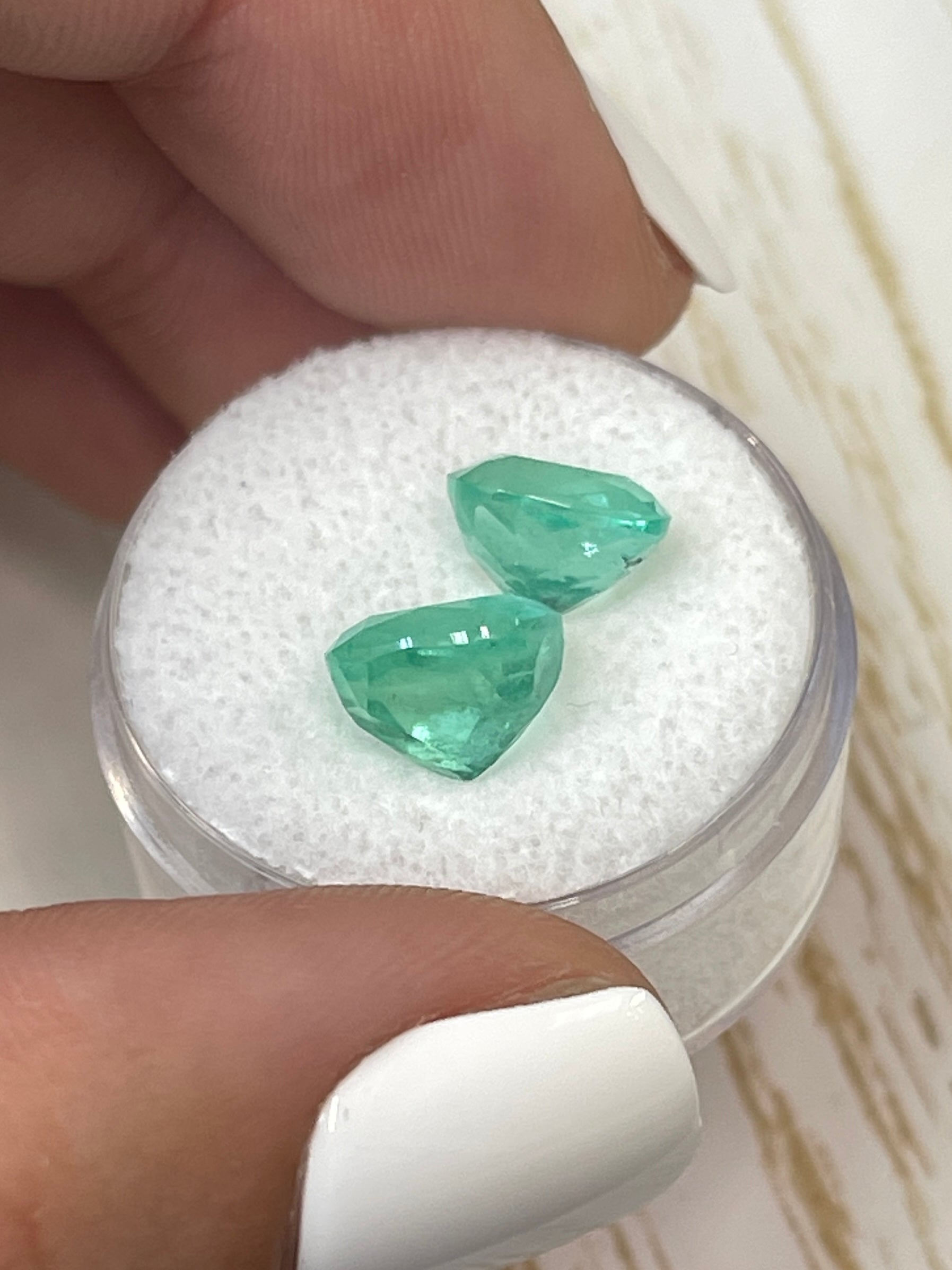 Light bluish green Colombian emeralds, cushion cut, 5.61 tcw, natural loose gemstones from JR Colombian Emeralds.