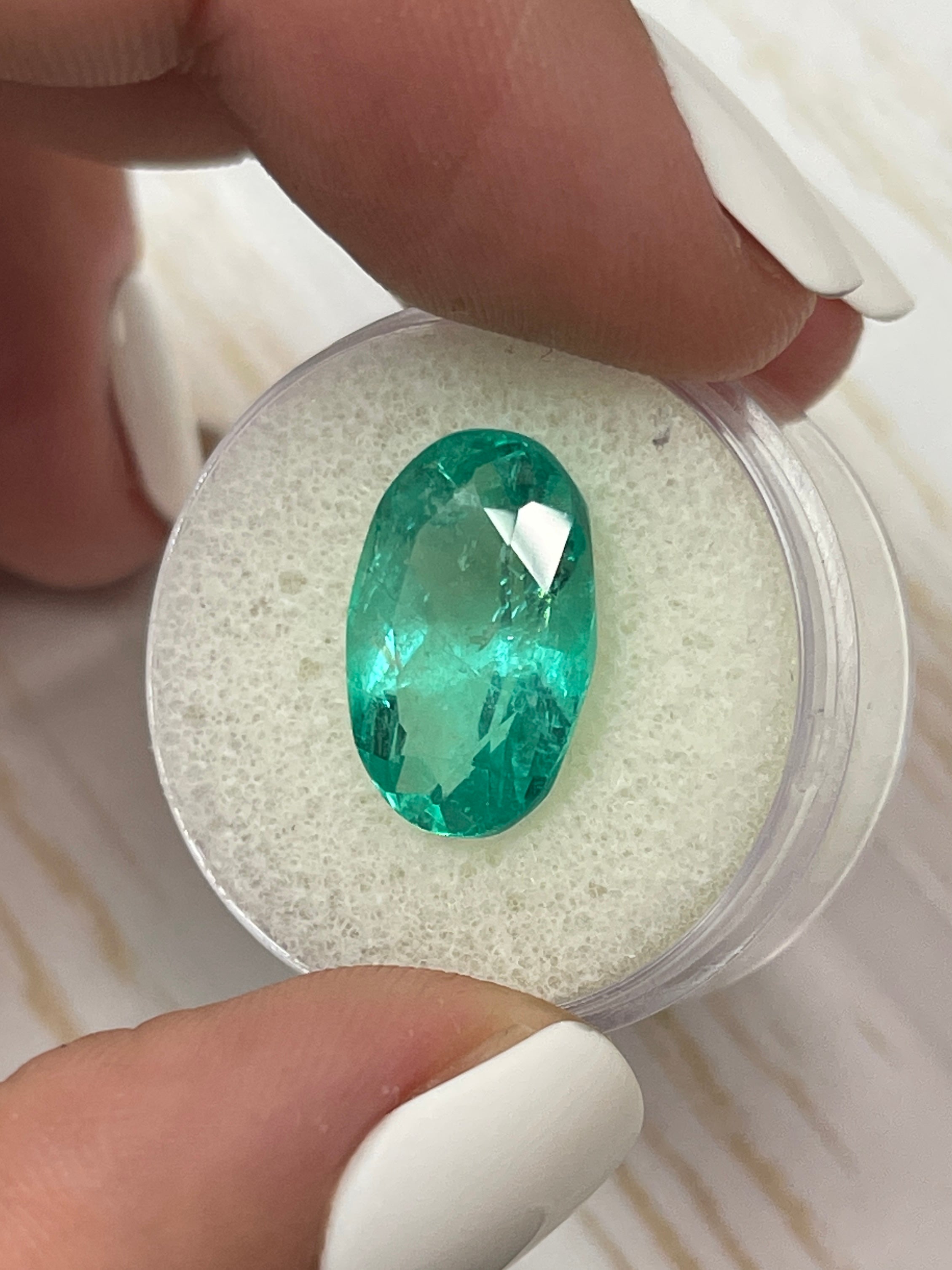 7.55 carat elongated bluish green Colombian emerald, oval cut, natural loose gemstone from JR Colombian Emeralds.