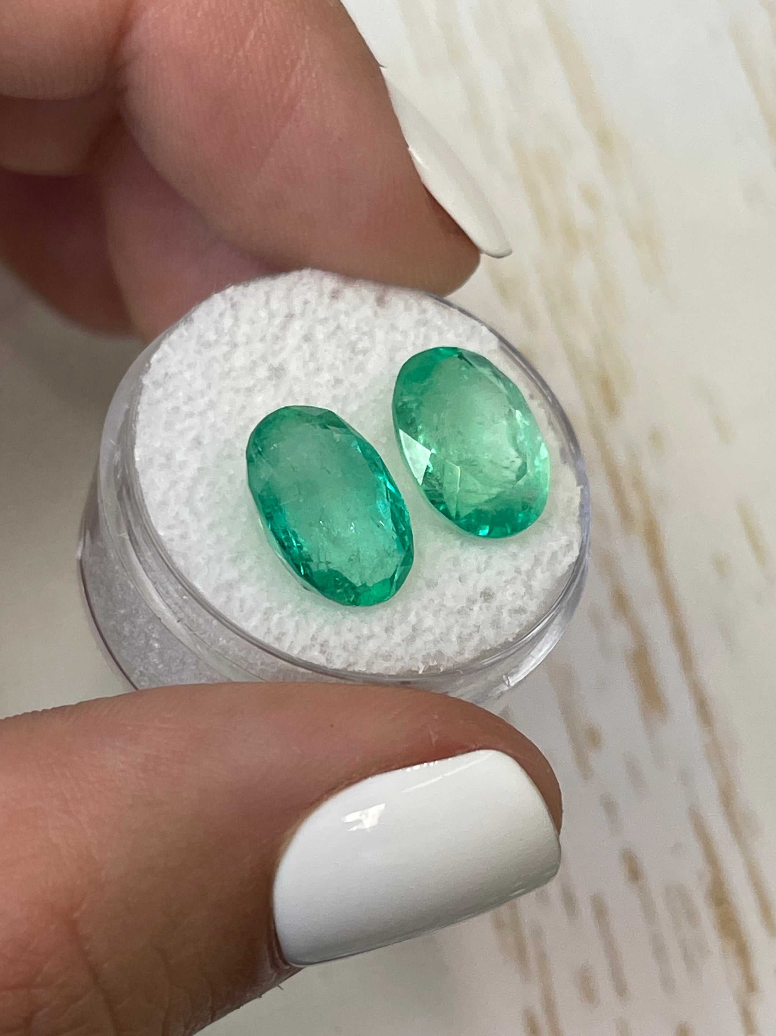Pair of 9.02 carat total weight Colombian emeralds in 13x9mm oval cut, set of matching loose gemstones by JR Colombian Emeralds.