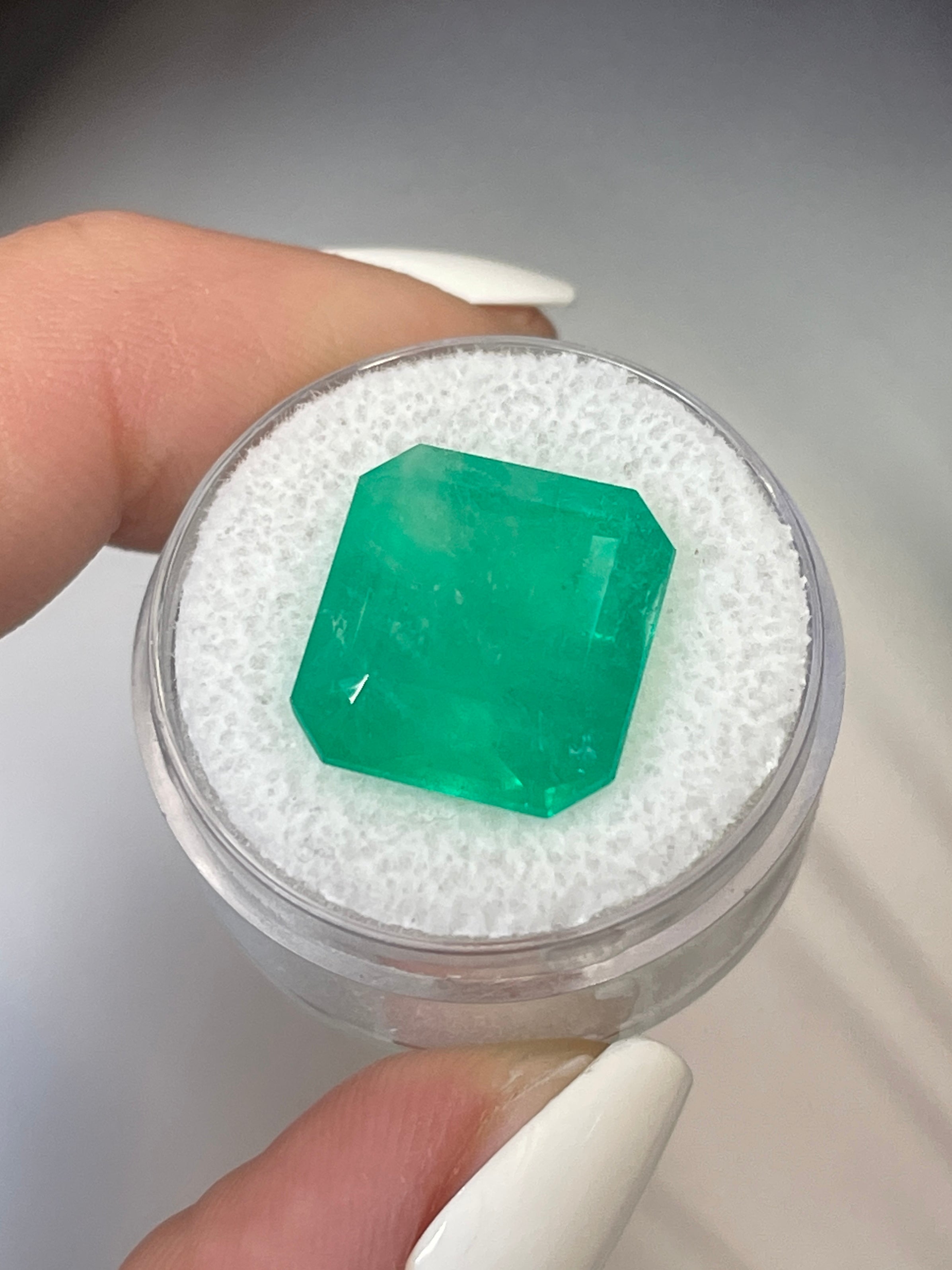 Large 12.09 carat Colombian emerald in 15x14mm Asscher cut, loose gemstone from JR Colombian Emeralds.
