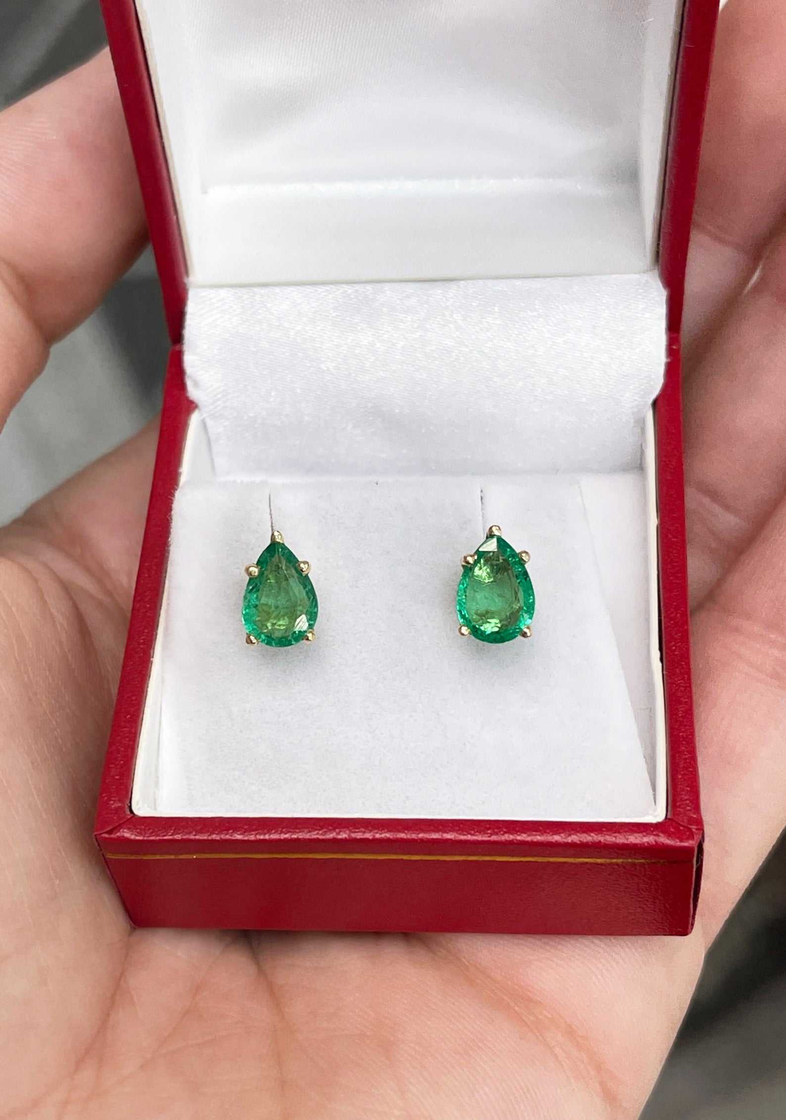 Natural pear cut emerald stud earrings in rich green, set in 14K yellow gold, 2.08tcw from JR Colombian Emeralds.