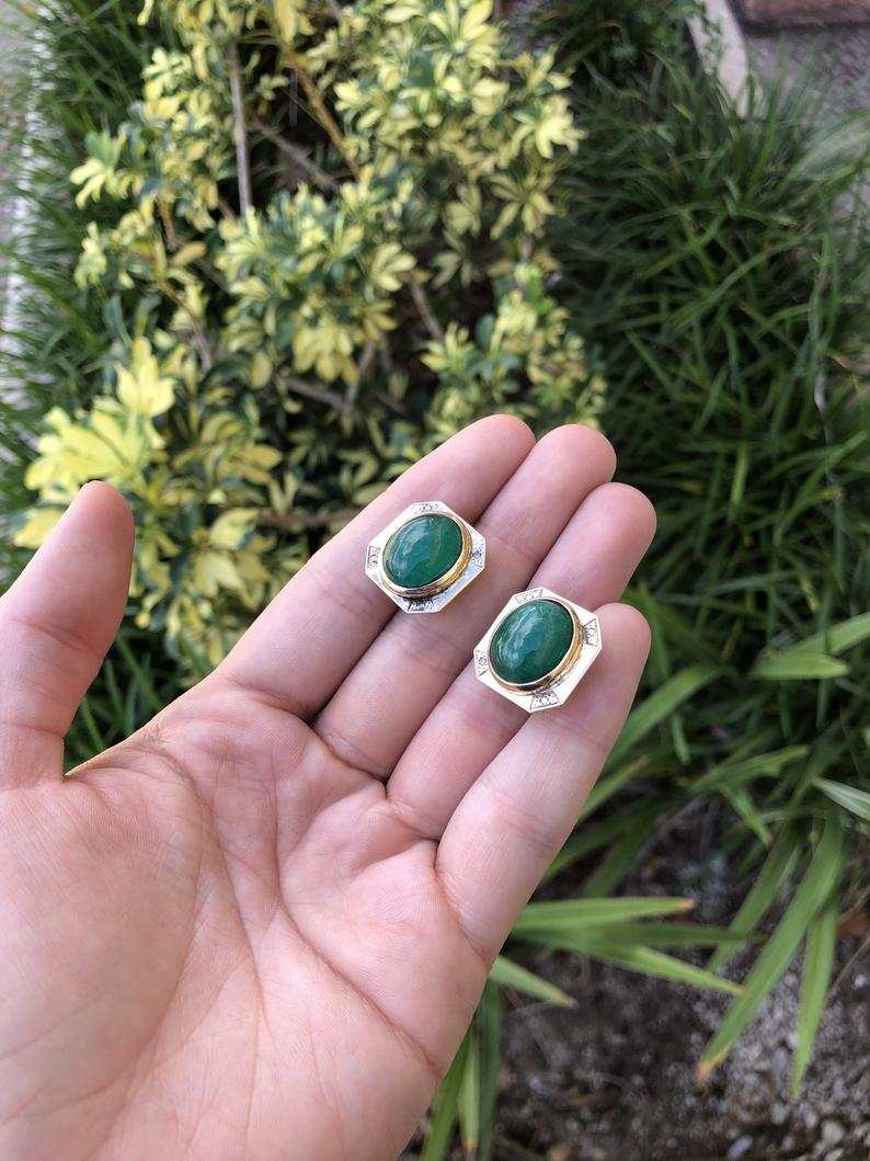 Large 22tcw Colombian emerald cabochon and diamond omega bezel earrings in 14K gold, featuring bold, elegant jewelry design.