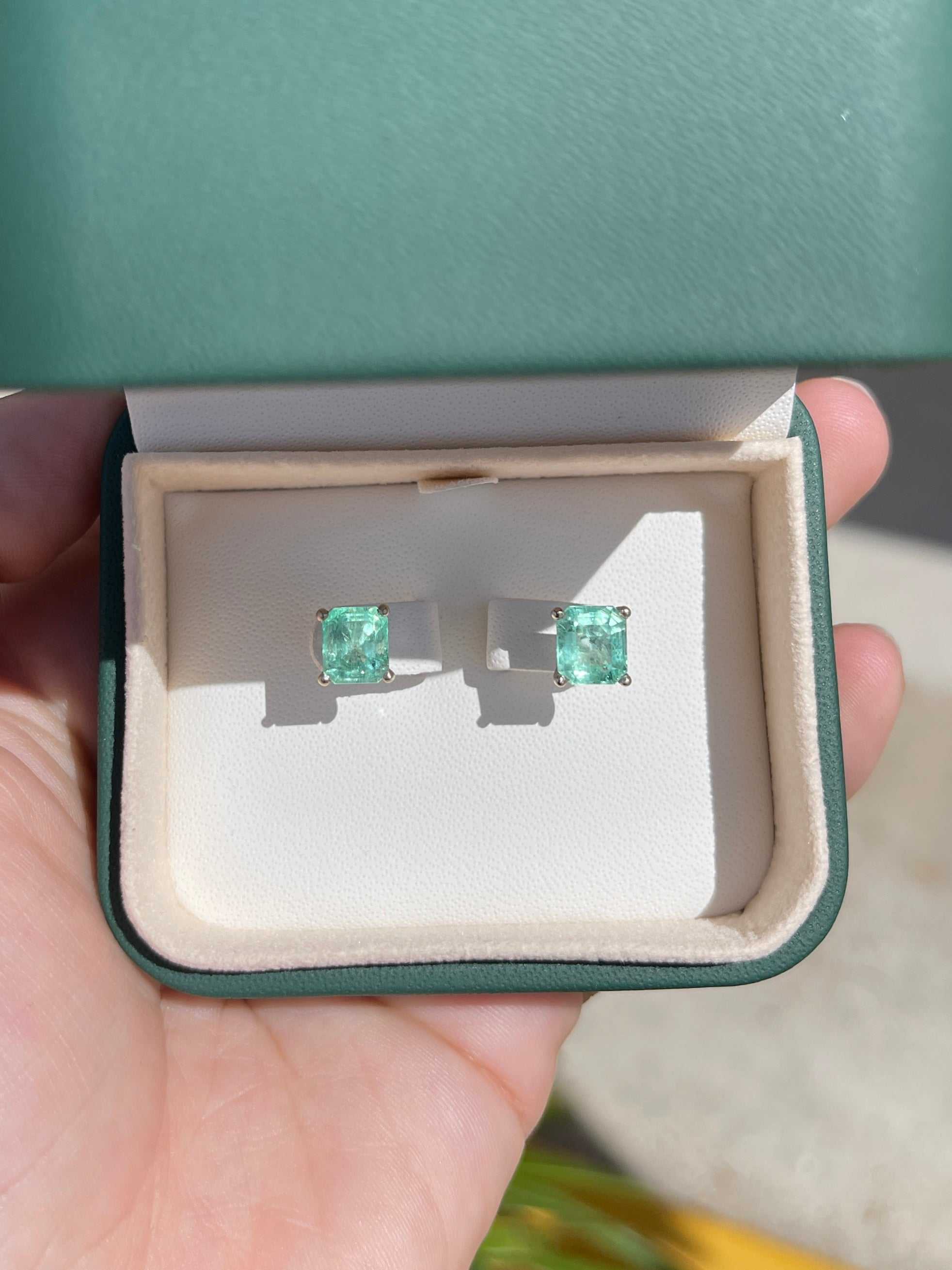 Light green Colombian emerald stud earrings in 18K white gold, featuring a 3.46tcw martini cut gemstone from JR Colombian Emeralds.