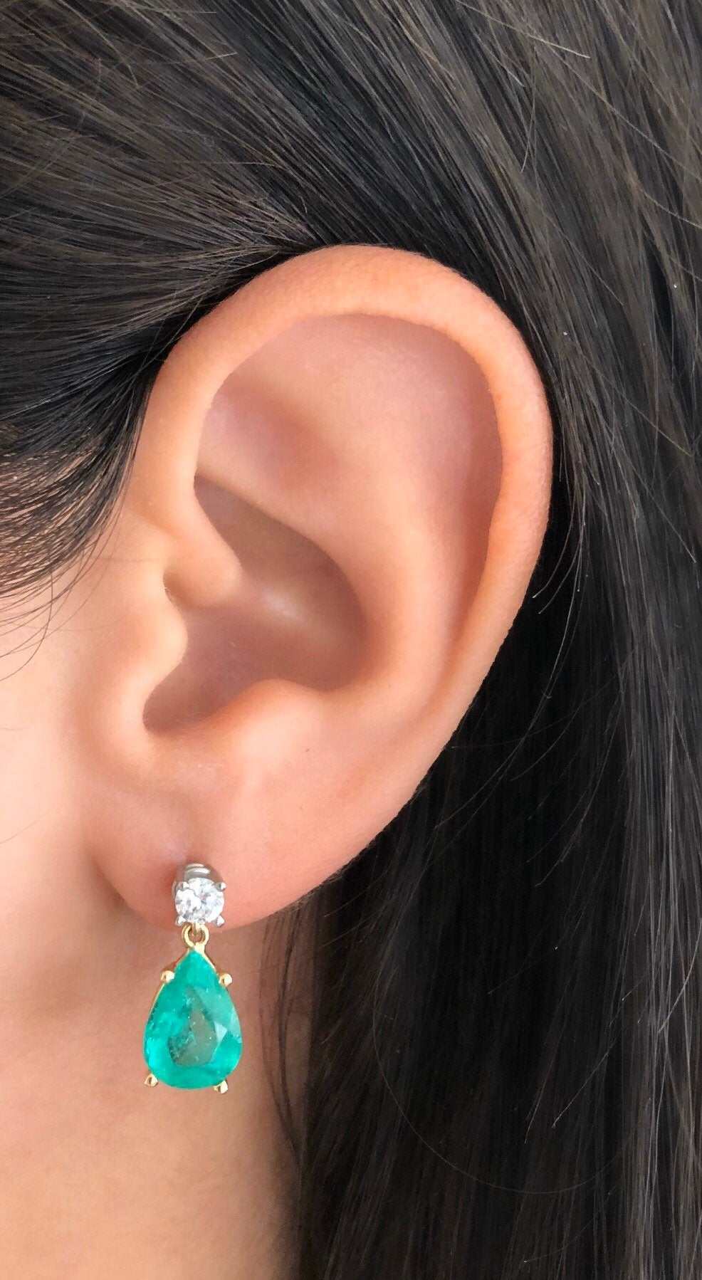 Natural tear drop emerald and diamond dangle earrings in 14K gold from JR Colombian Emeralds, featuring 5.80tcw of gemstones.