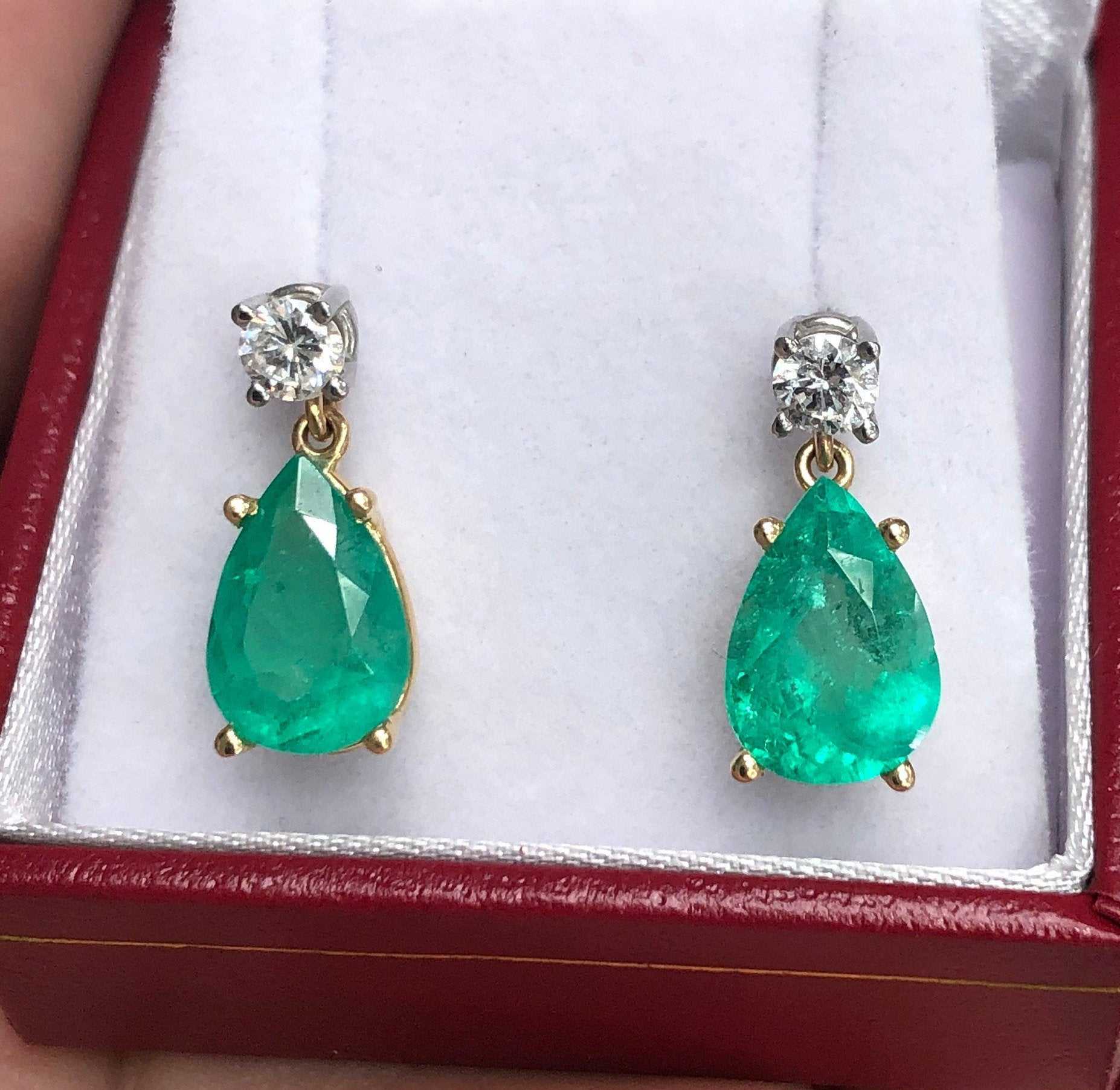 Natural tear drop emerald and diamond dangle earrings in 14K gold by JR Colombian Emeralds, featuring sparkling gemstones.