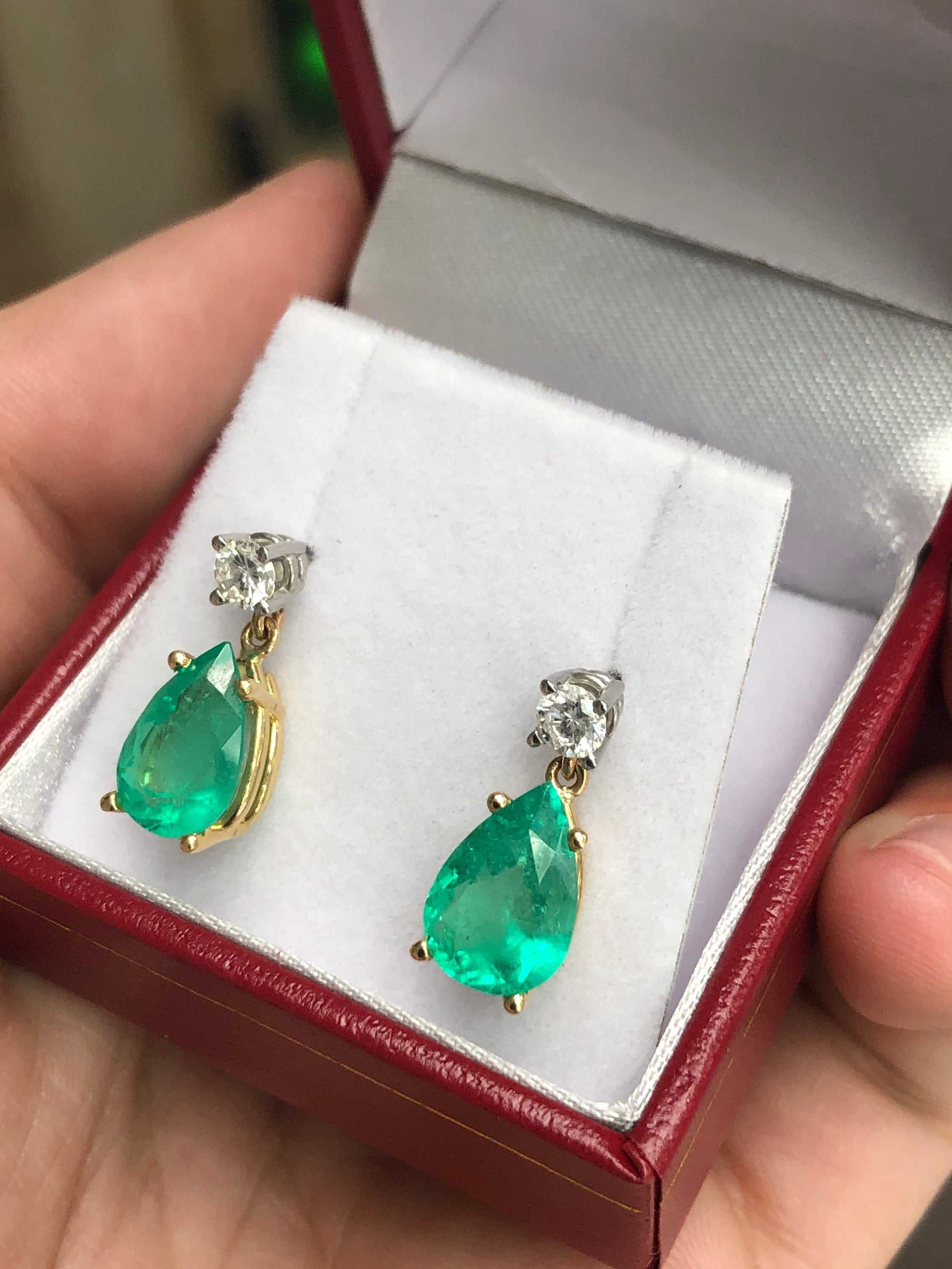 Natural tear drop emerald and diamond dangle earrings in 14K gold by JR Colombian Emeralds, showcasing elegant gemstone and metal design.