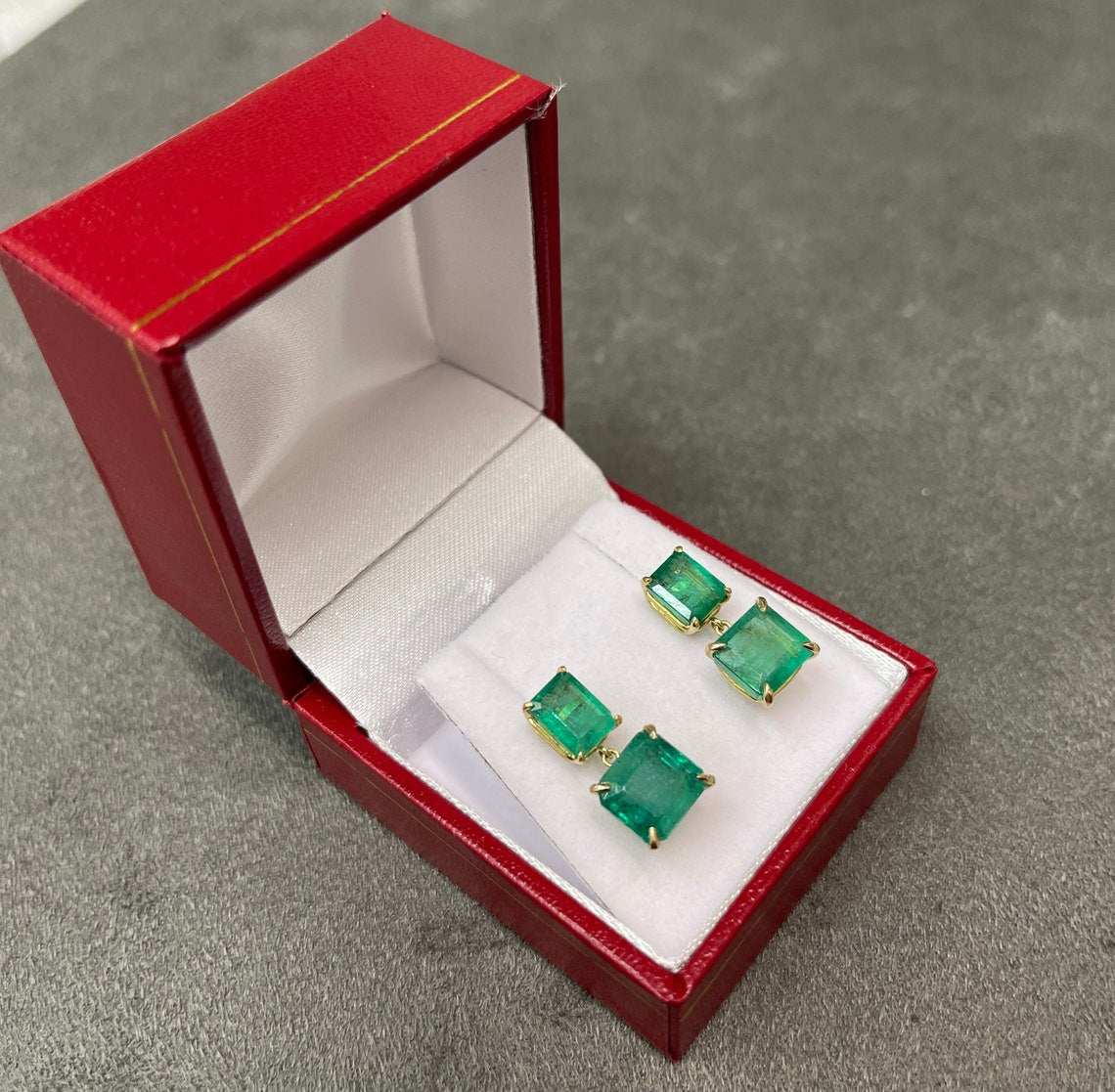 JR Colombian Emeralds 6.0tcw Natura emerald green dangle earrings in 14K gold, featuring vivid dark green emerald drops.