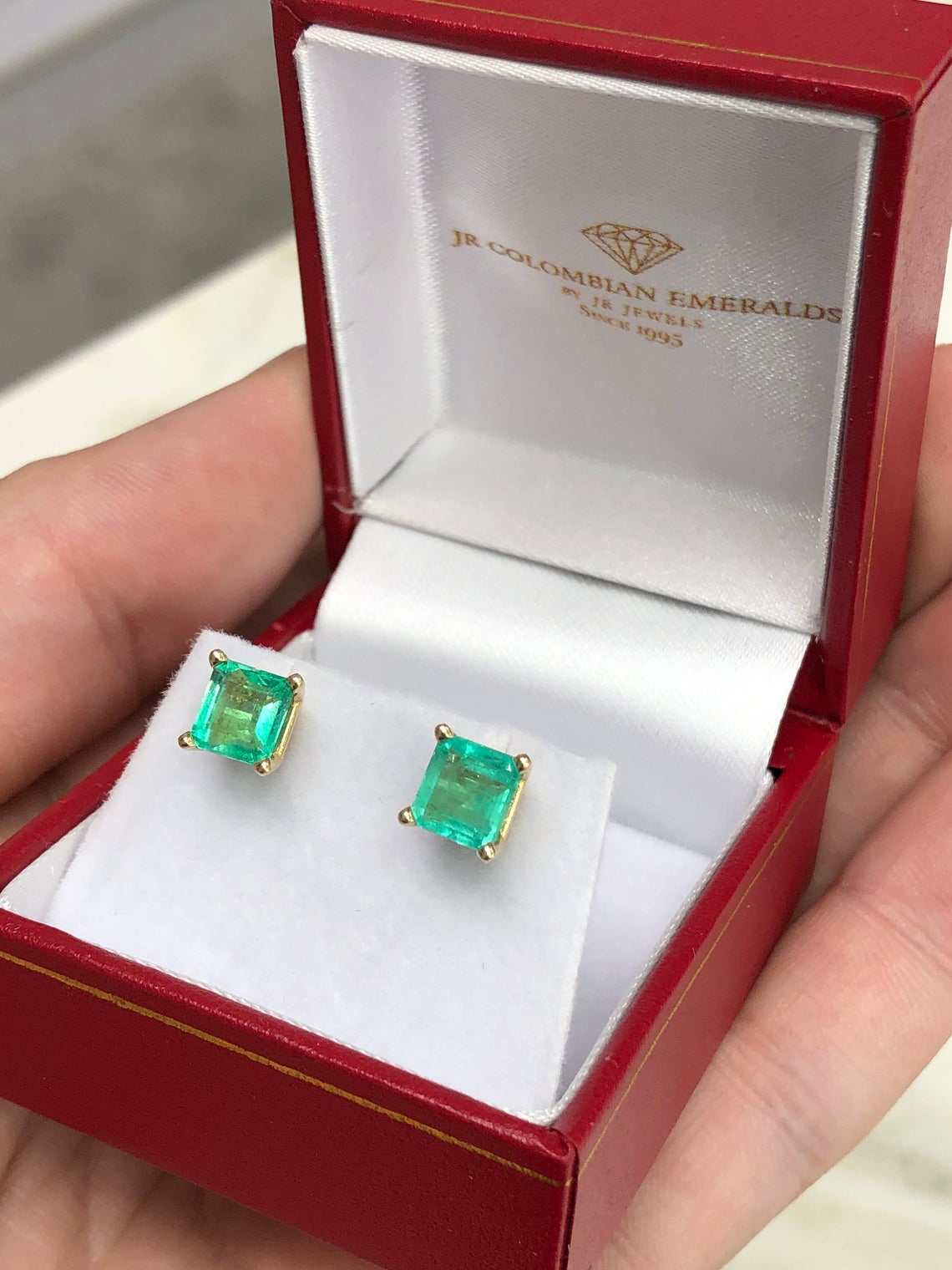 Asscher shape medium green emerald earrings in 14K white gold with screw-back clasps, featuring 2.0 tcw certified emeralds by JR Colombian Emeralds.