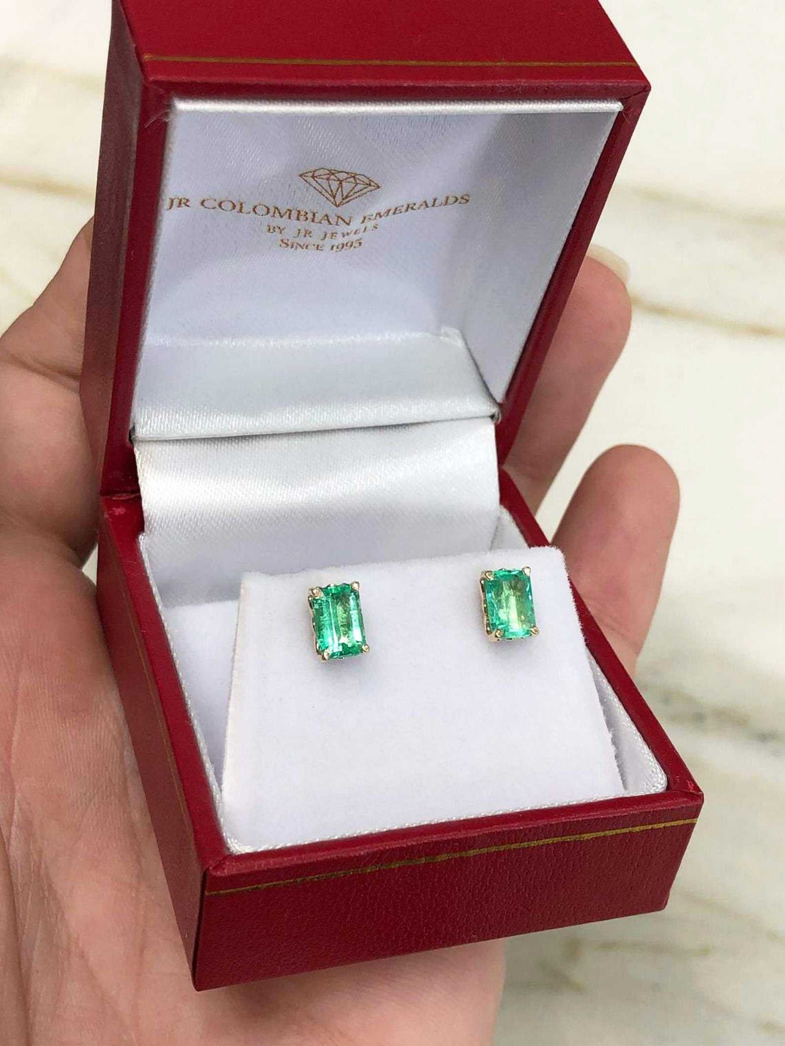 Trendy 1.50ctw Colombian emerald cut fleur de lis stud earrings in 14K gold by JR Colombian Emeralds.