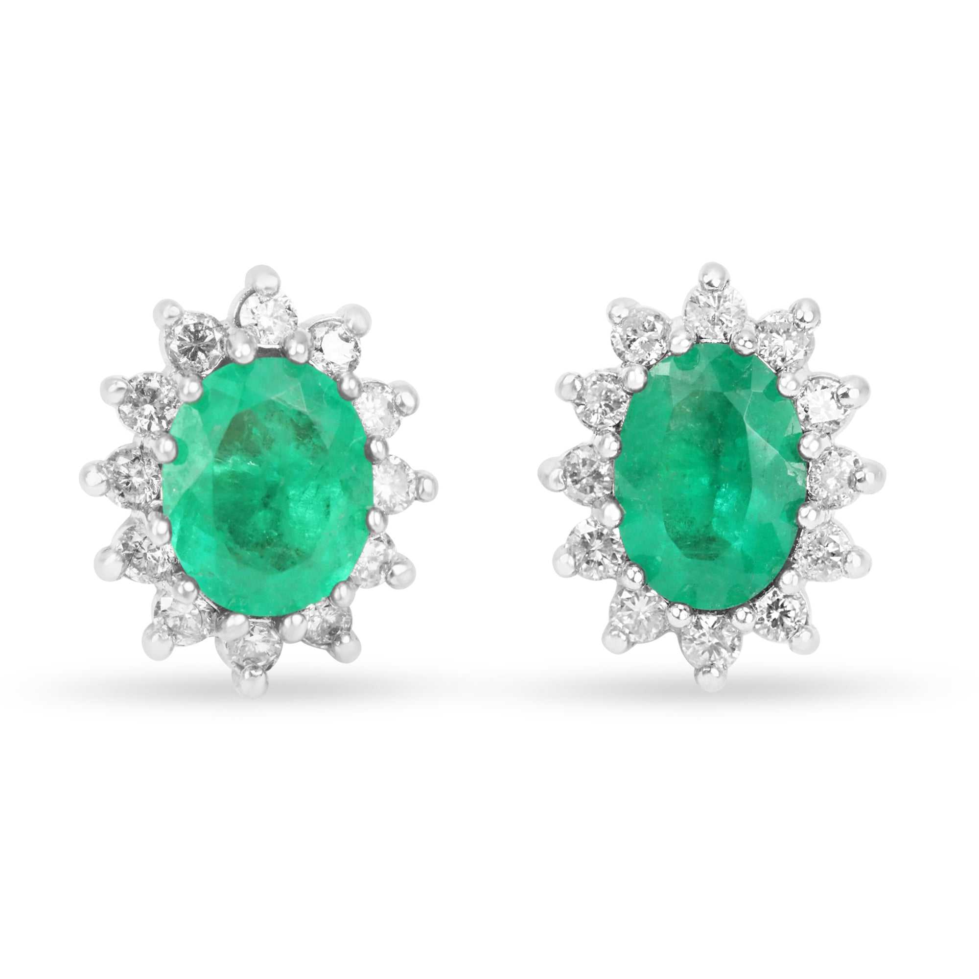 14K gold earrings with oval cut emeralds and round diamonds in a cluster halo design by JR Colombian Emeralds.