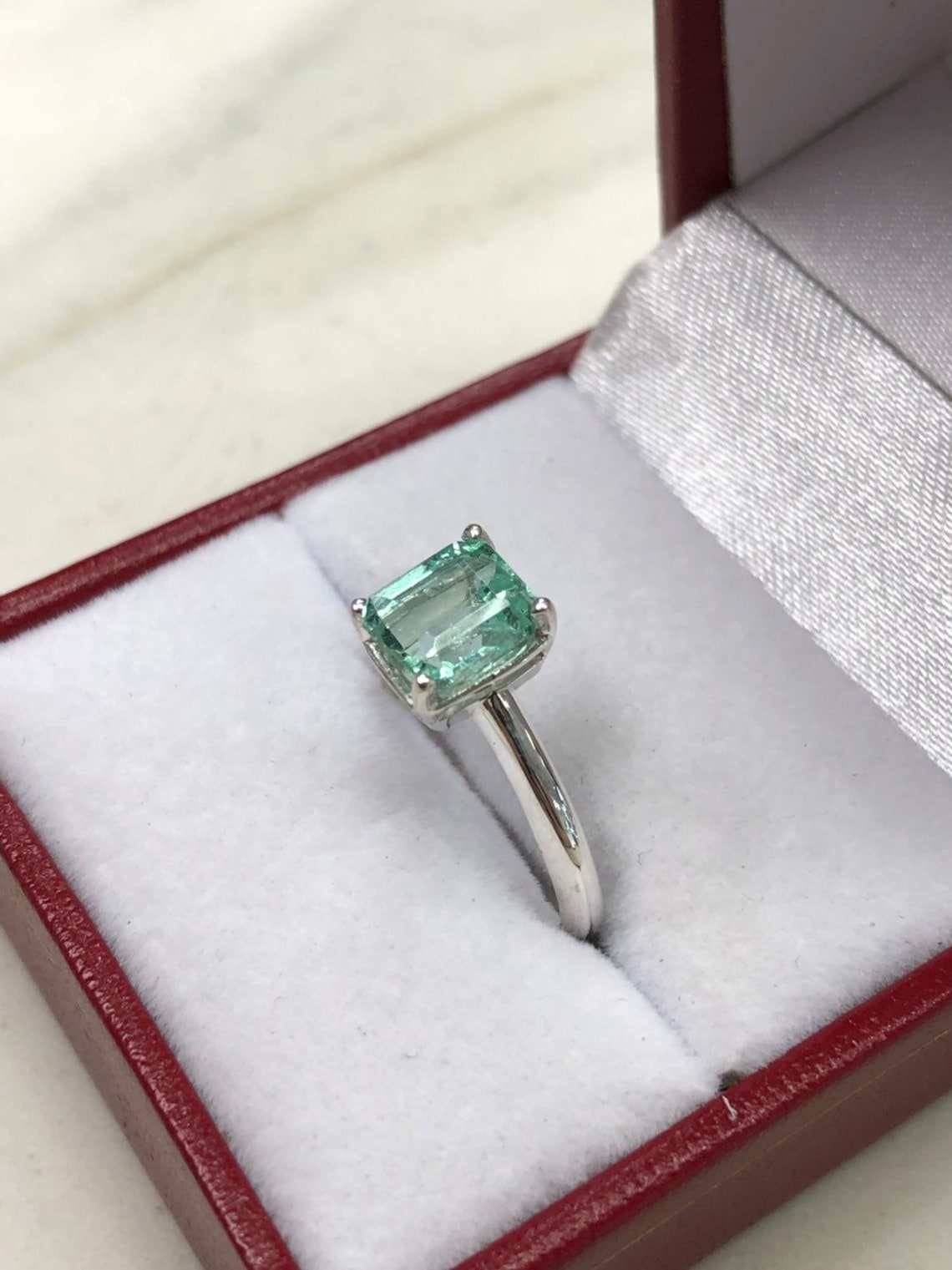 1.50 Carats Emerald Cut Emerald Solitaire Straight Shank Engagement Ring