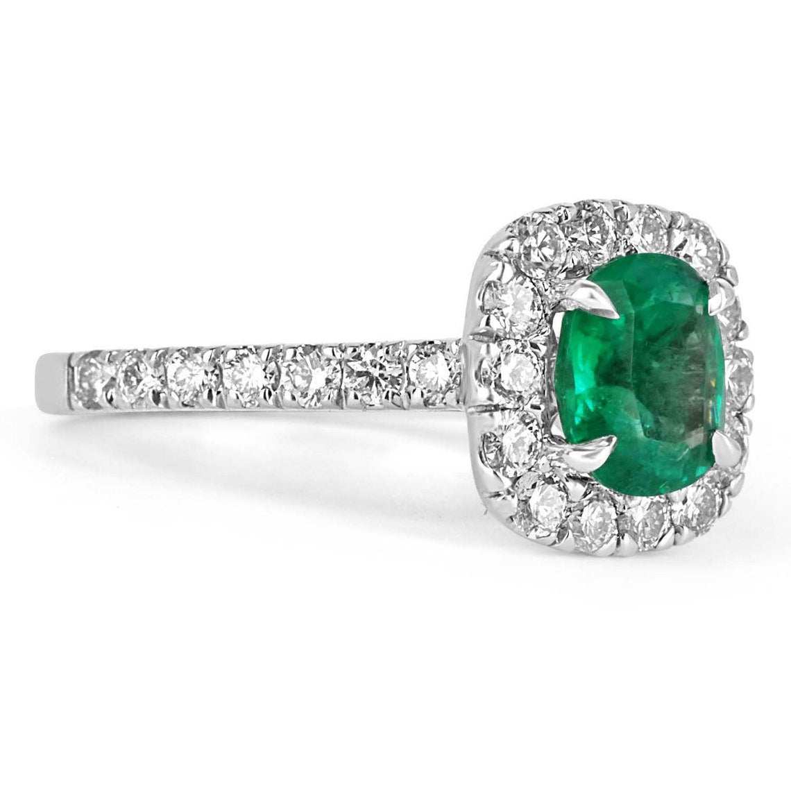 Natural emerald and diamond halo engagement ring in 14K gold with 2.31tcw from JR Colombian Emeralds, featuring intricate gemstone details.