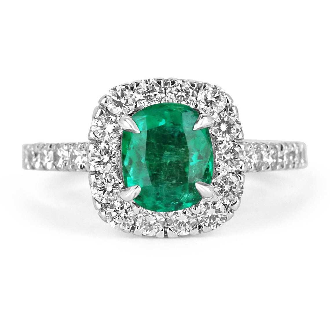 Natural emerald and diamond halo engagement ring with 2.31 carats in 14K gold, featuring a detailed design and sparkling gemstones.