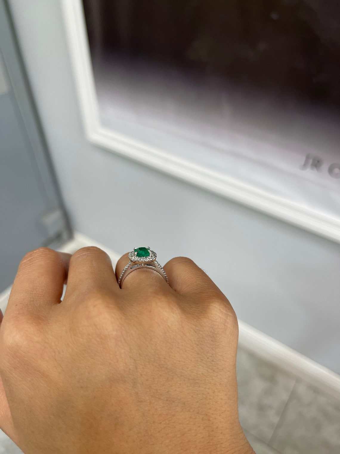 Natural emerald and diamond halo engagement ring in 14K gold with detailed gemstone setting, by JR Colombian Emeralds.