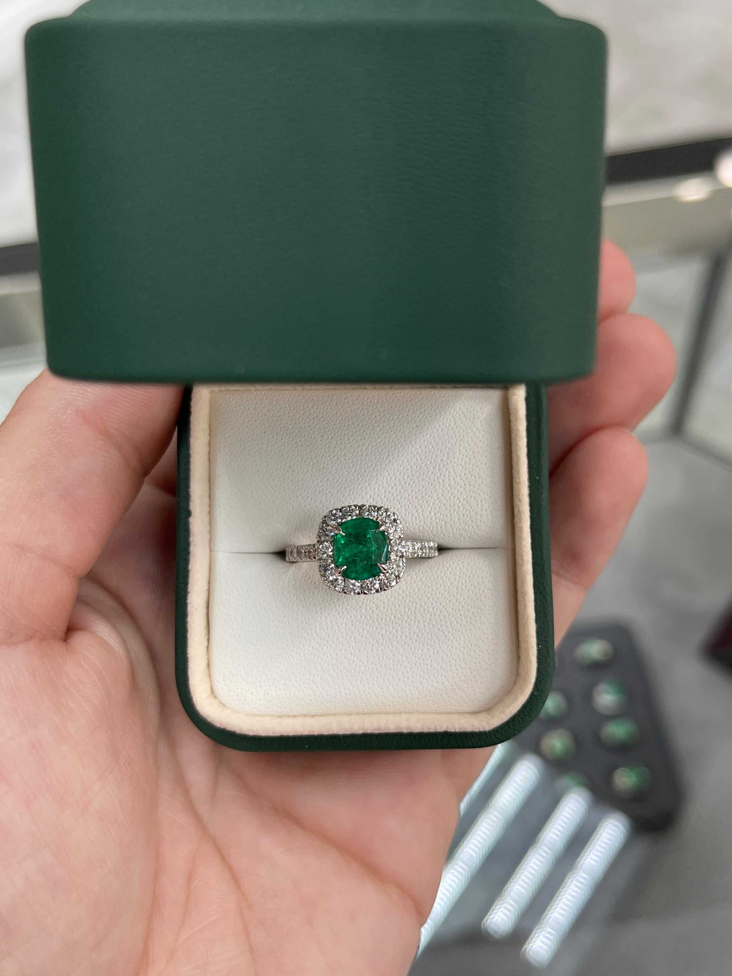 Natural emerald and diamond halo engagement ring in 14K gold, featuring a 2.31tcw emerald and sparkling diamonds.
