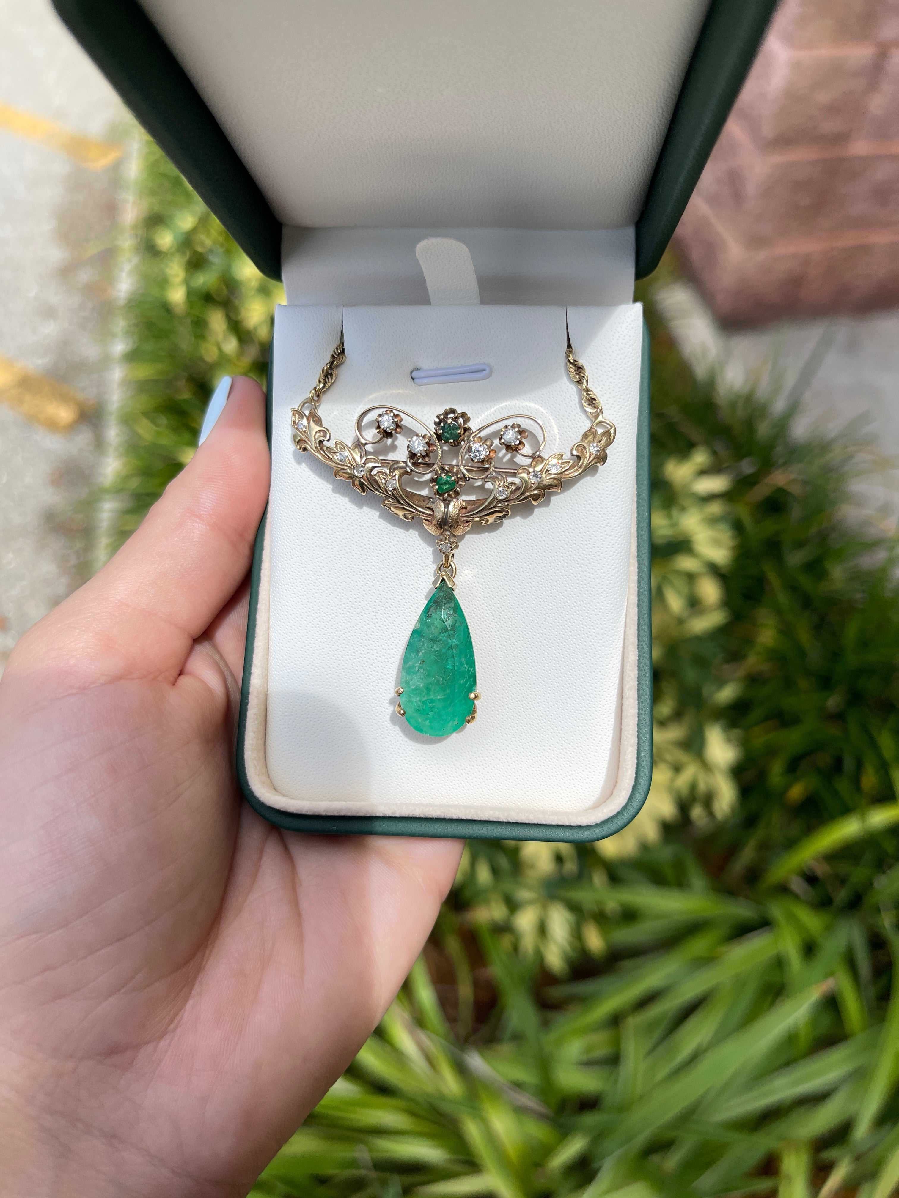 Vintage 14.97tcw pear-shaped Colombian emerald and diamond pendant necklace and brooch with 14K gold setting.