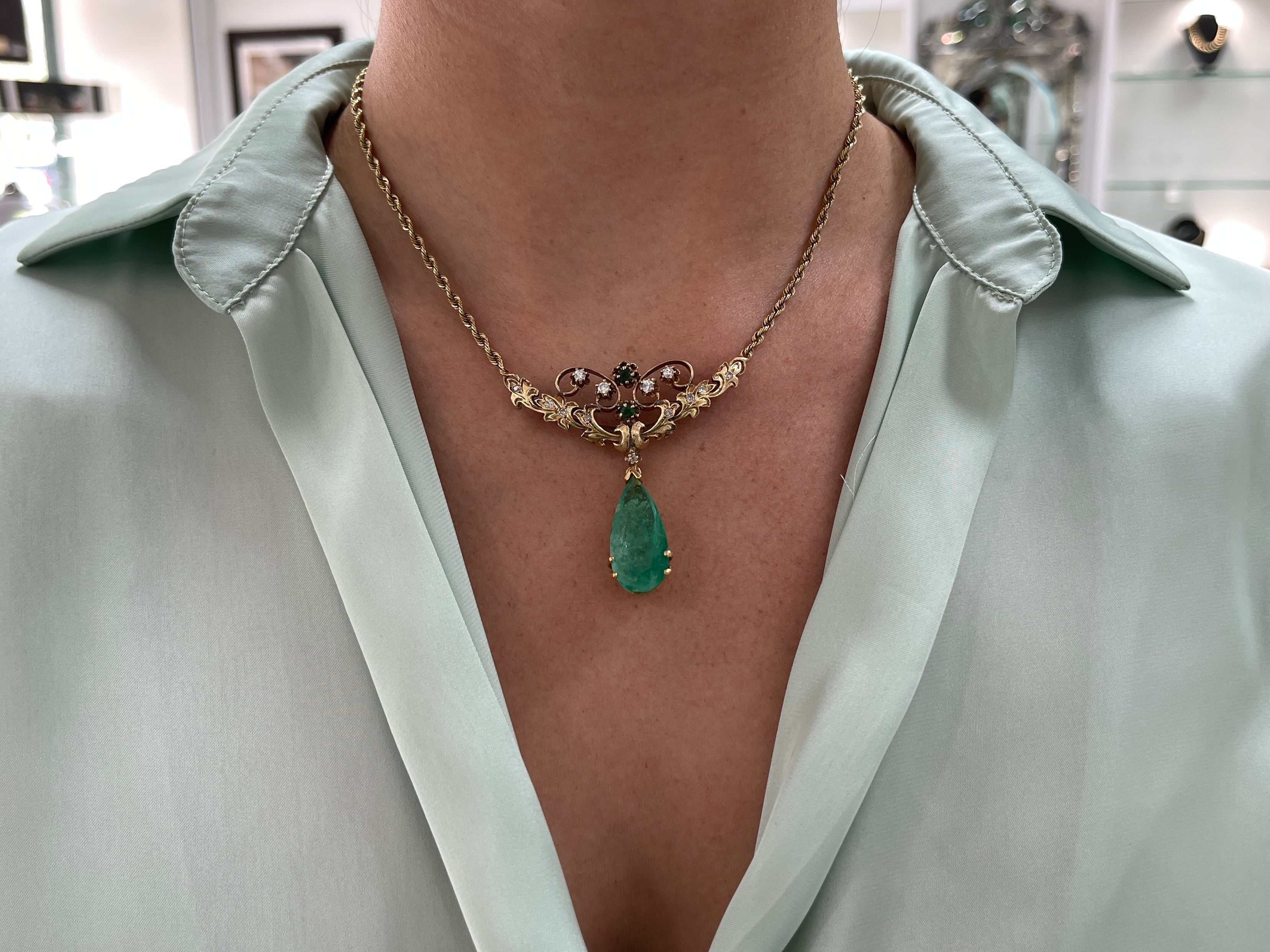 Vintage 14.97tcw pear-shaped Colombian emerald and diamond pendant necklace and brooch in 14K gold.