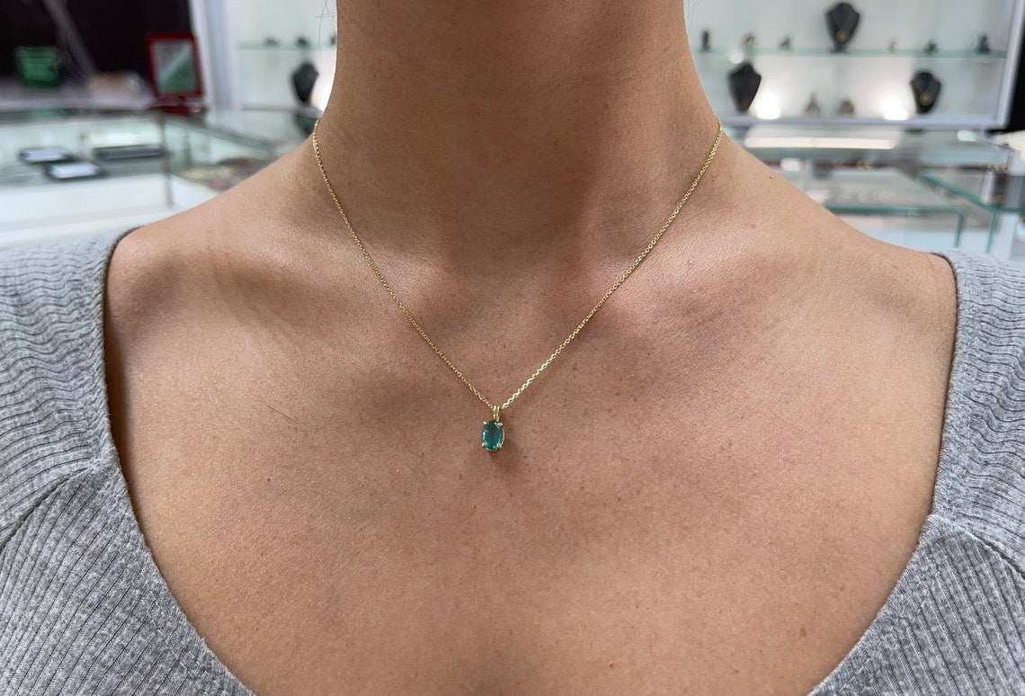 Natural bluish green 1.15 carat oval cut emerald solitaire pendant in 14K gold from JR Colombian Emeralds.
