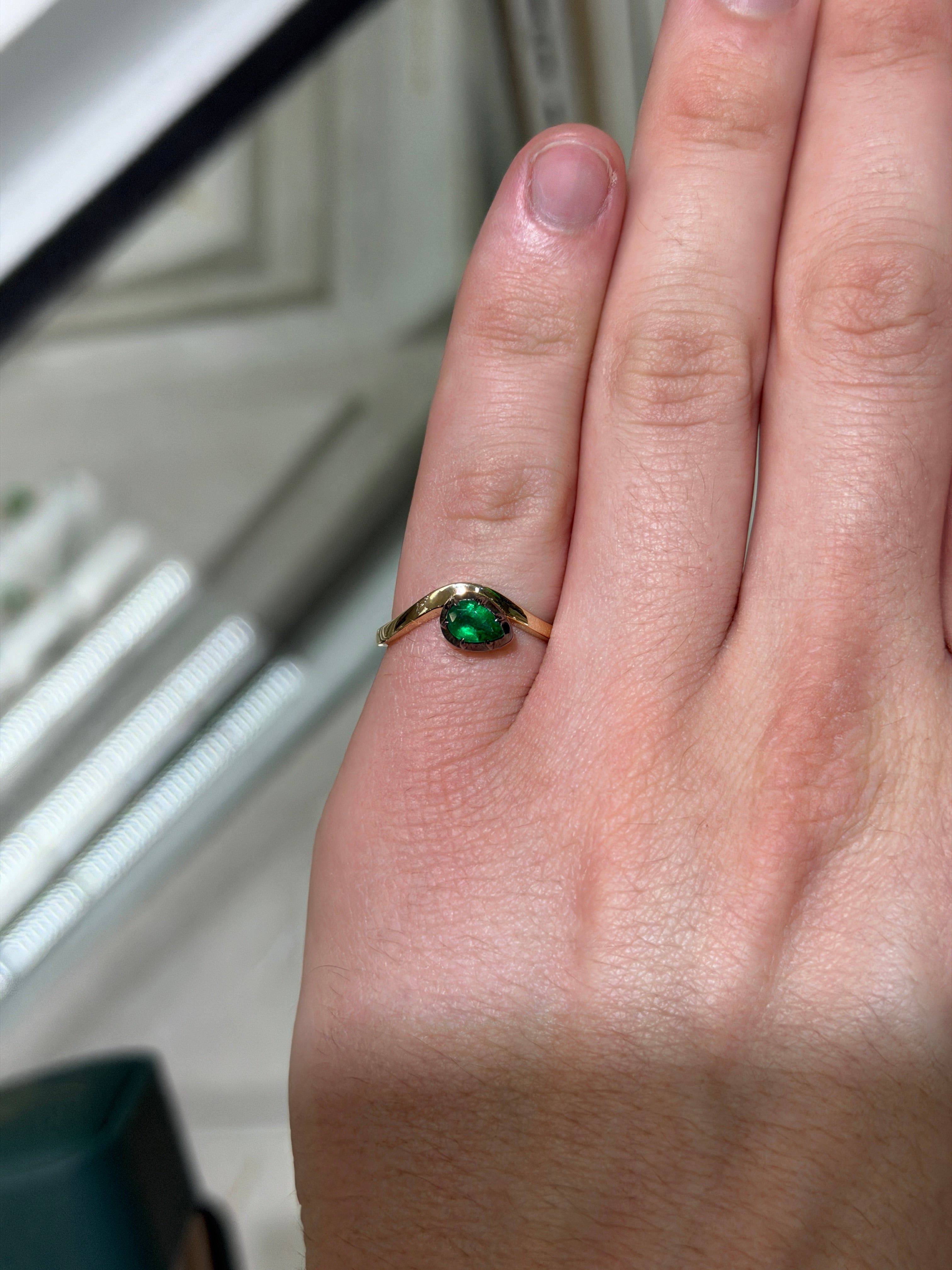 14K gold emerald solitaire ring with black rhodium detailing, featuring a 0.46ct pear cut natural emerald by JR Colombian Emeralds