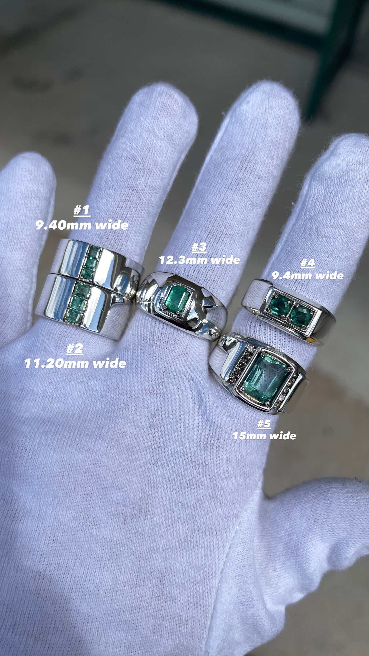 Natural emerald mens ring set in sterling silver with various emerald sizes displayed on glove fingers