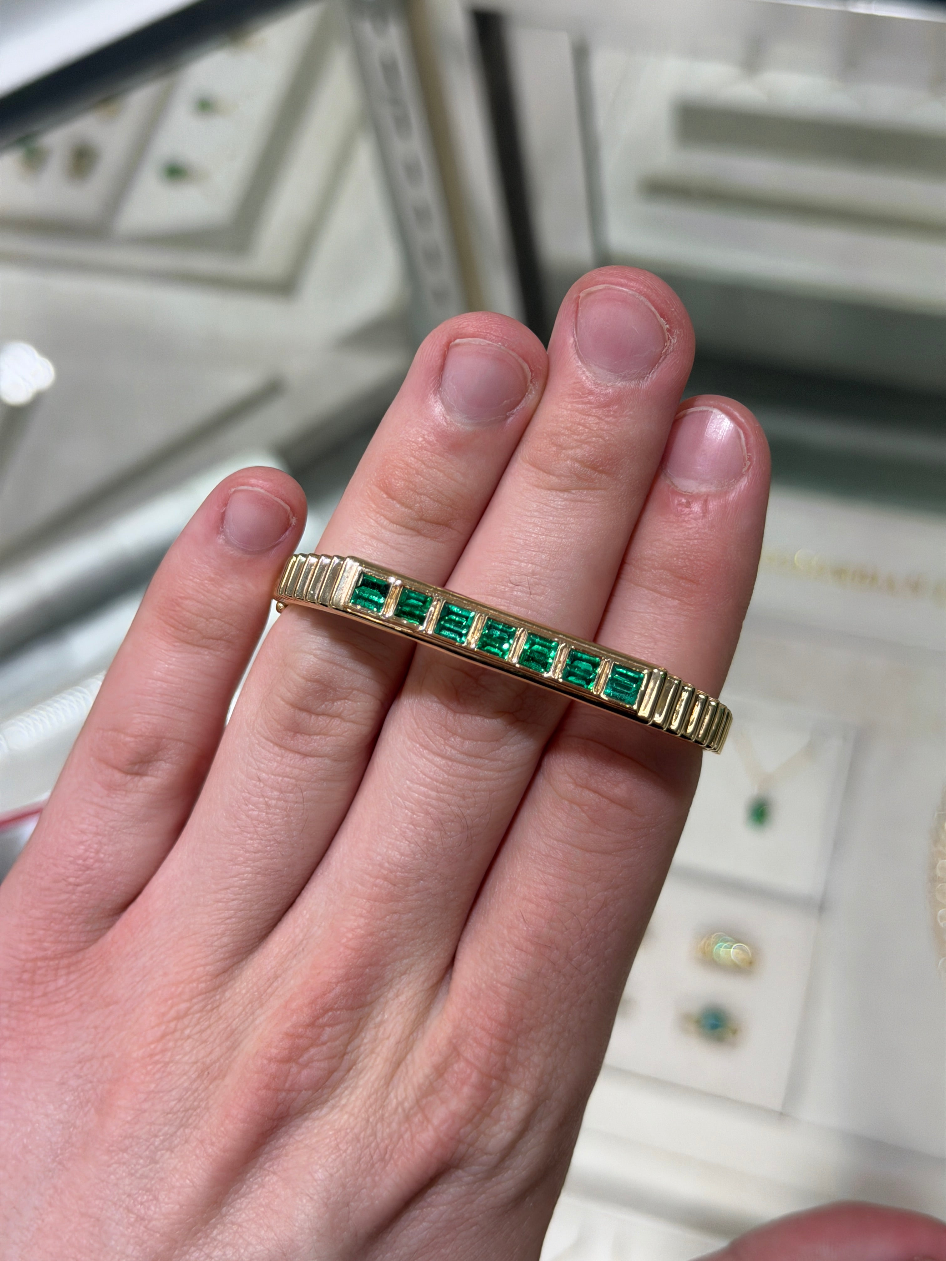 14K gold bangle bracelet with 1.64tcw princess cut emeralds, bezel set in a ribbed design by JR Colombian Emeralds.