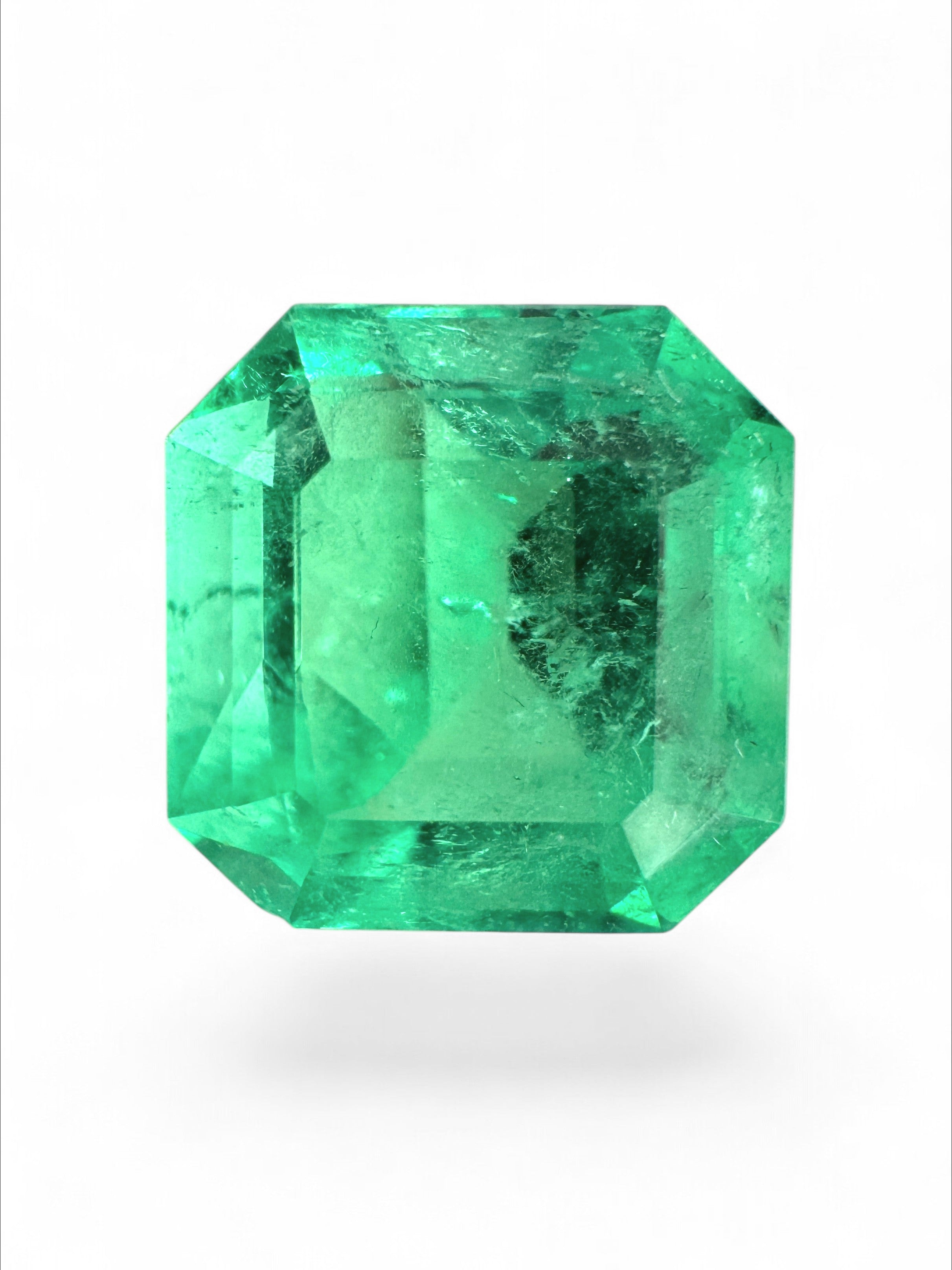 4.57 carat Colombian emerald Asscher cut loose gemstone with clipped corners, vibrant green color, from JR Colombian Emeralds.