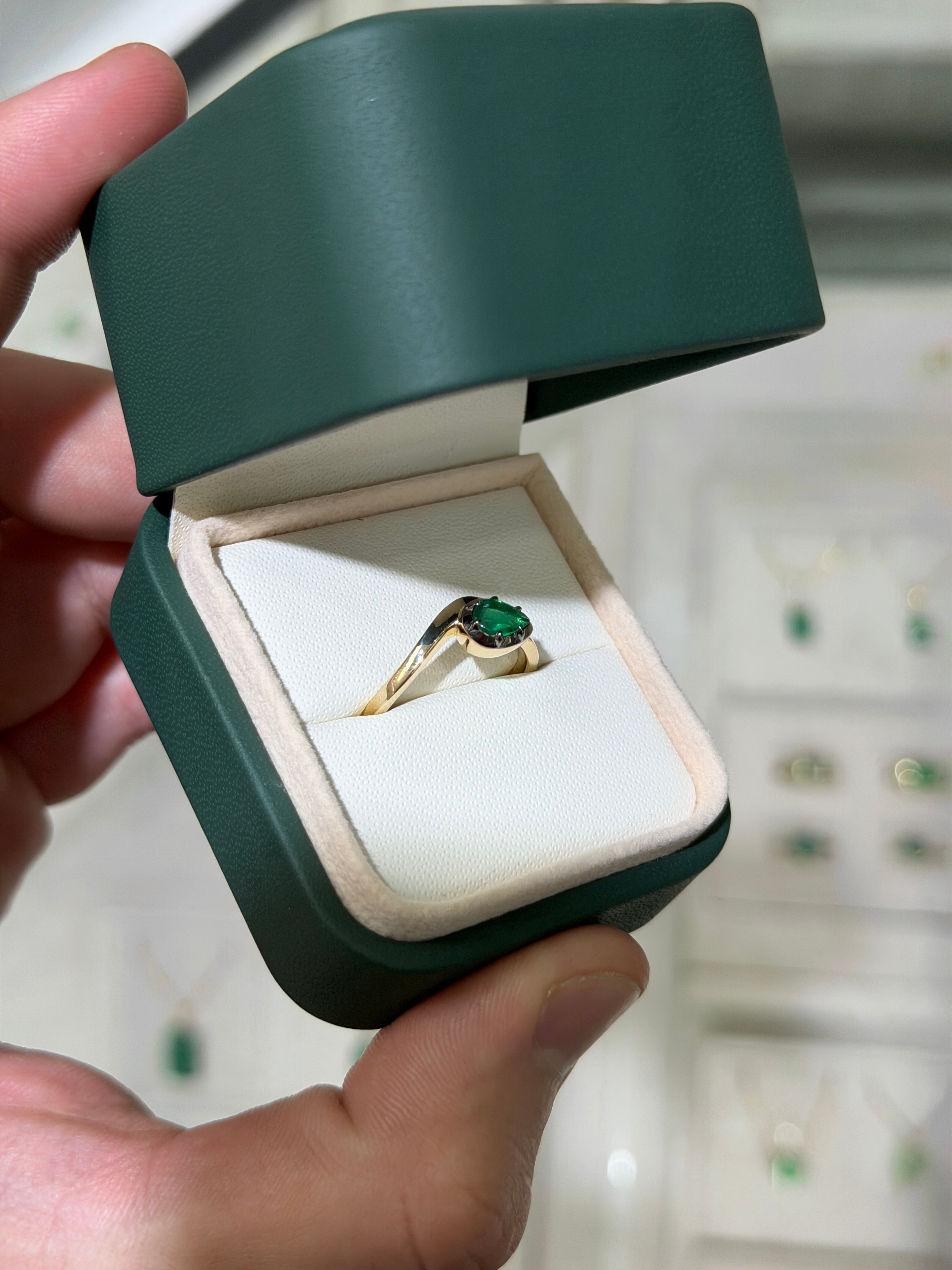 14K gold emerald solitaire ring with black rhodium plating and a 0.46ct pear-cut natural emerald, by JR Colombian Emeralds.