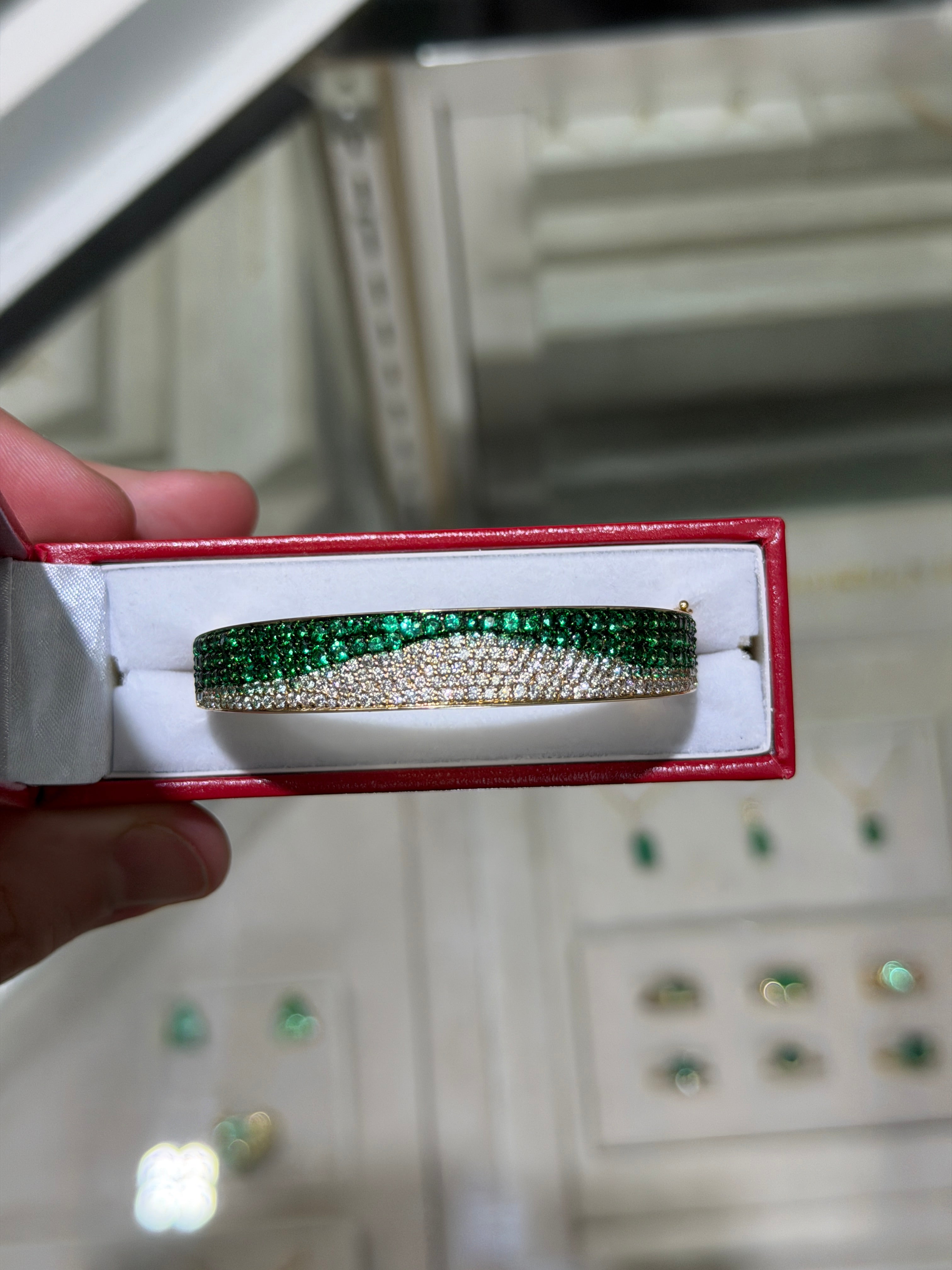 14K natural emerald and diamond ombre bangle bracelet with black and green rhodium by JR Colombian Emeralds, showcasing green and black accents.