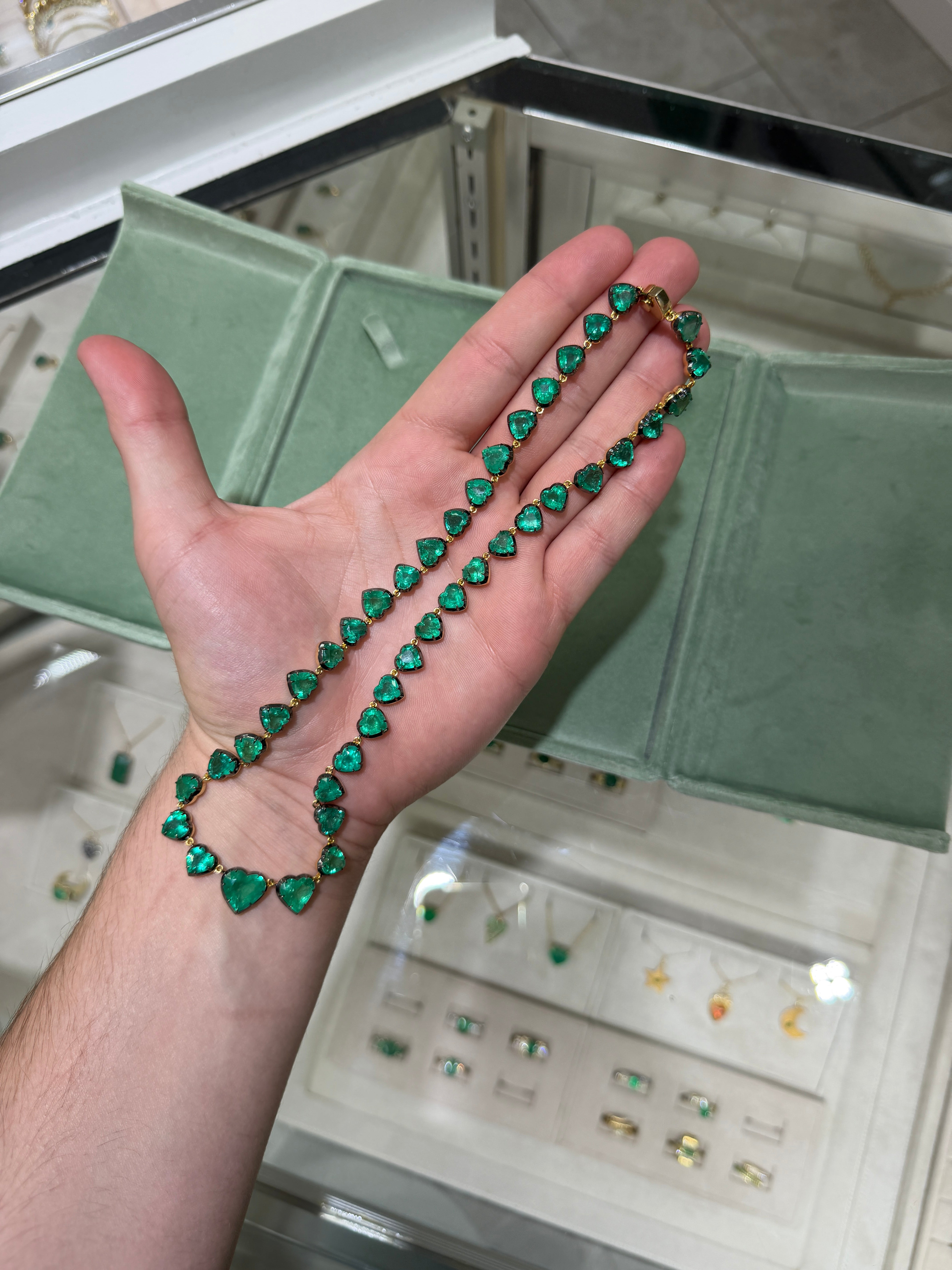 14K gold custom cut heart emerald tennis necklace with black rhodium, 18-inch length, featuring 60.98tcw of gemstones by JR Colombian Emeralds.
