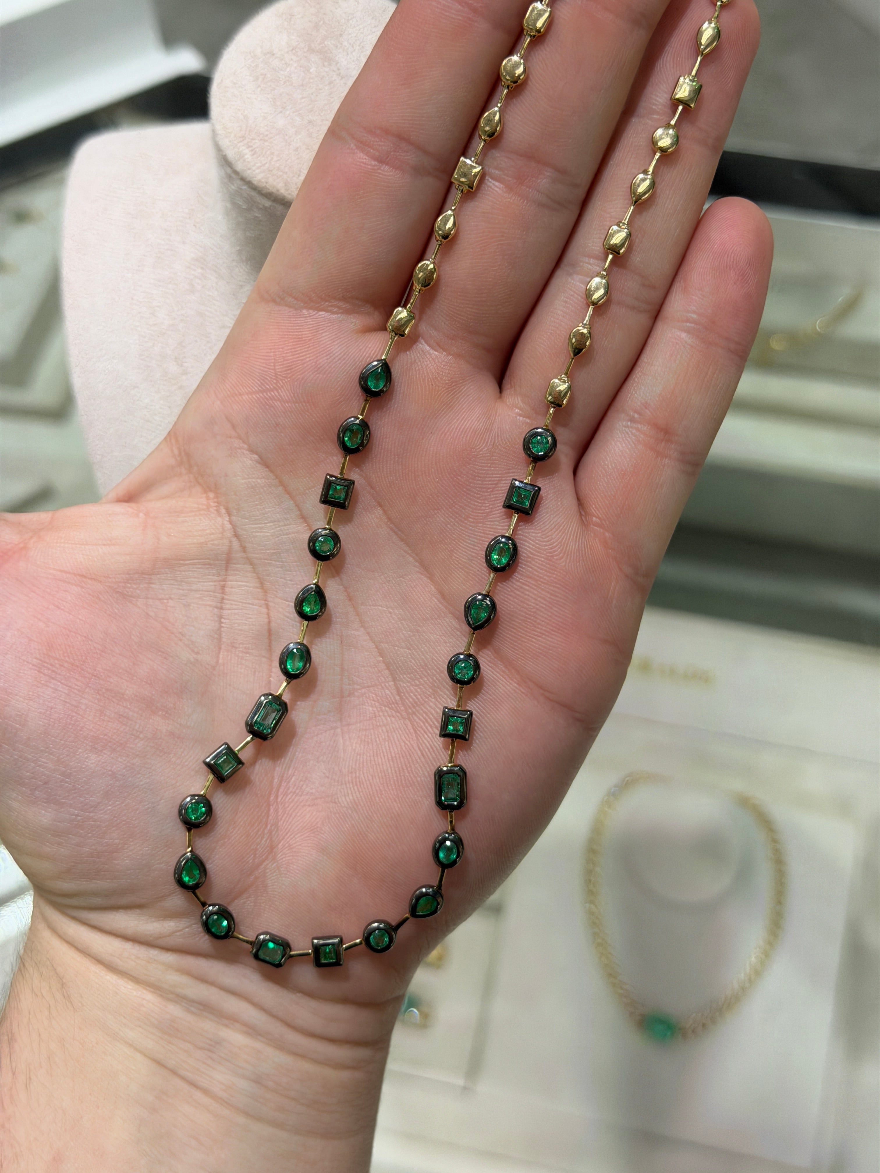 14K gold emerald tennis necklace with bezel-set mixed cut emeralds and black rhodium accents, 18-inch length by JR Colombian Emeralds