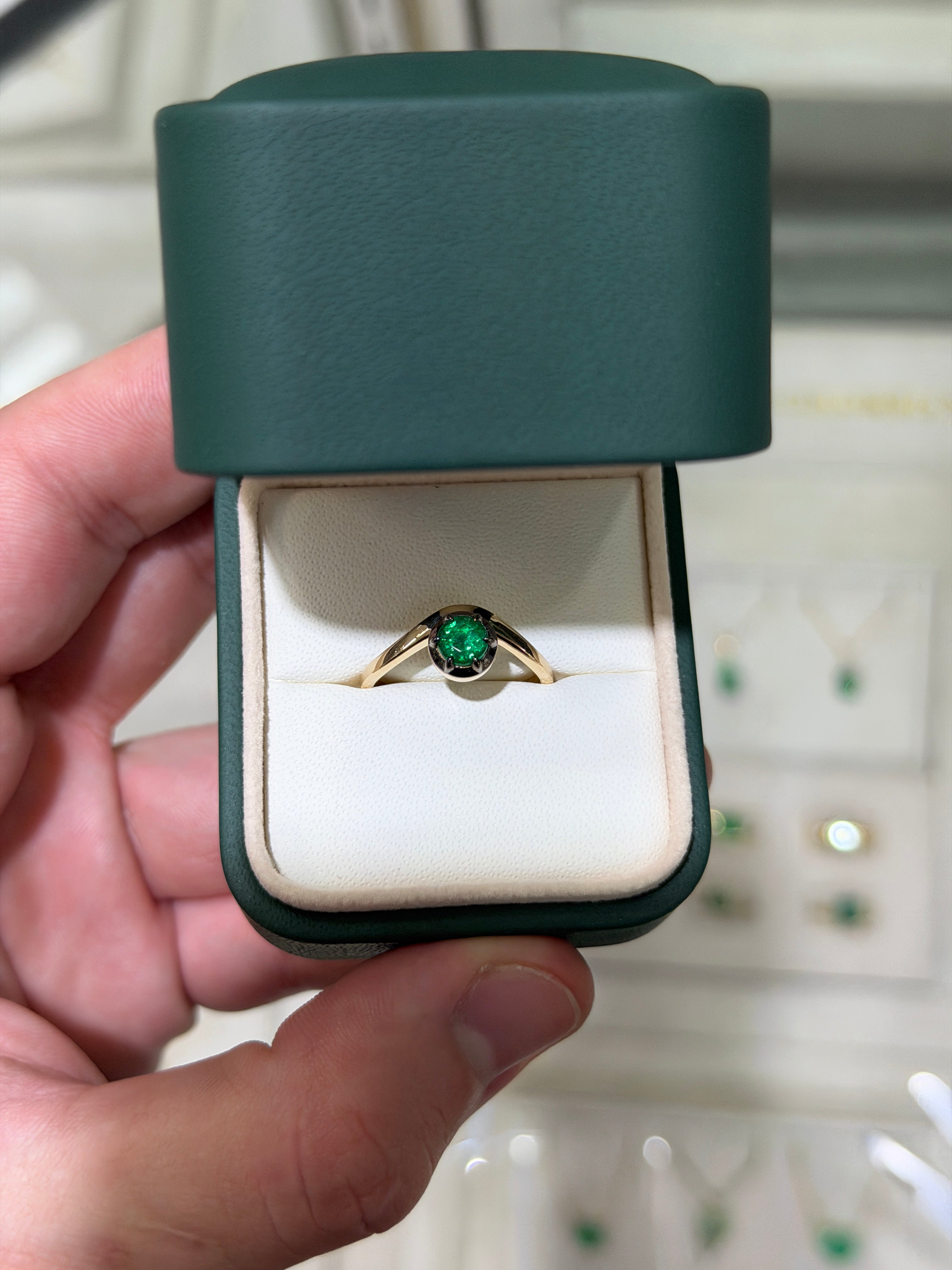 Ladies emerald ring with 0.64ct round cut emerald, 14K gold, multi-prong setting, black rhodium finish, by JR Colombian Emeralds.