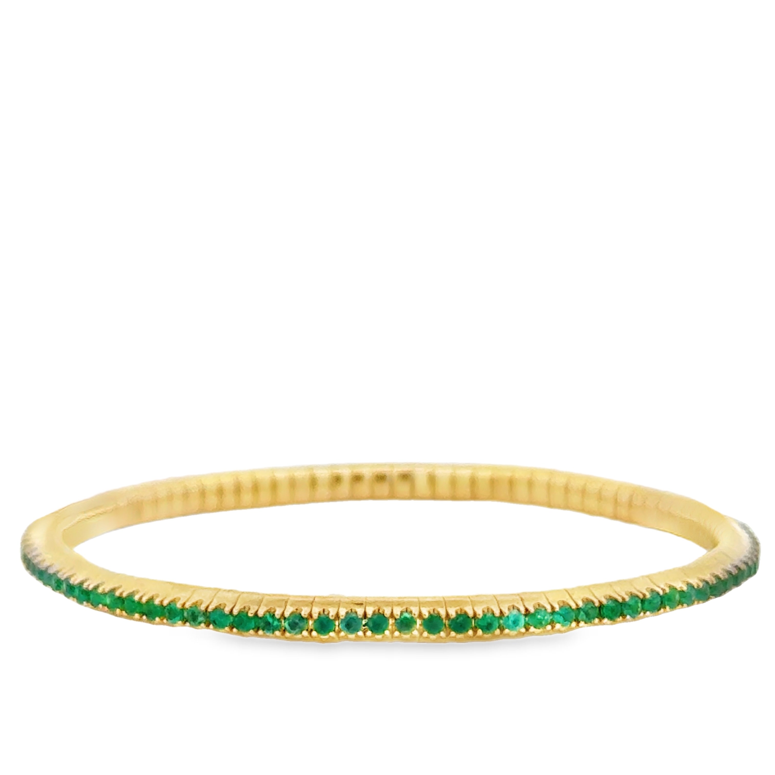 14K gold tennis bracelet with round emeralds totaling 3.30 carats, featuring a stretchy design and natural Colombian emeralds.