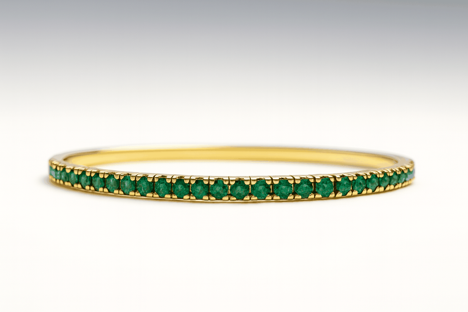 18K Gold stretchy tennis bracelet with natural round green emeralds in prong setting