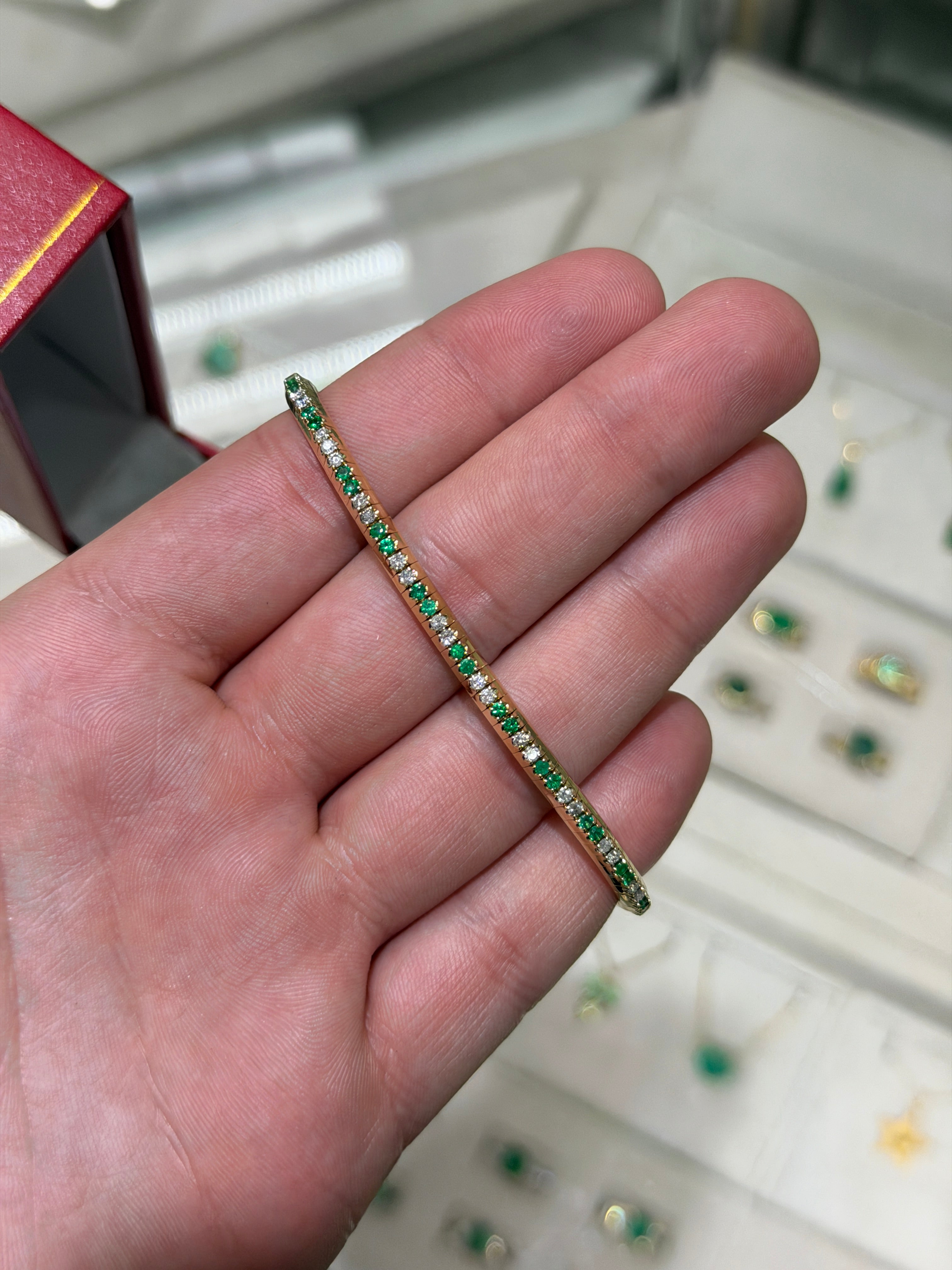 14K gold tennis bracelet with alternating natural emeralds and diamonds, prong set, stretchy design from JR Colombian Emeralds