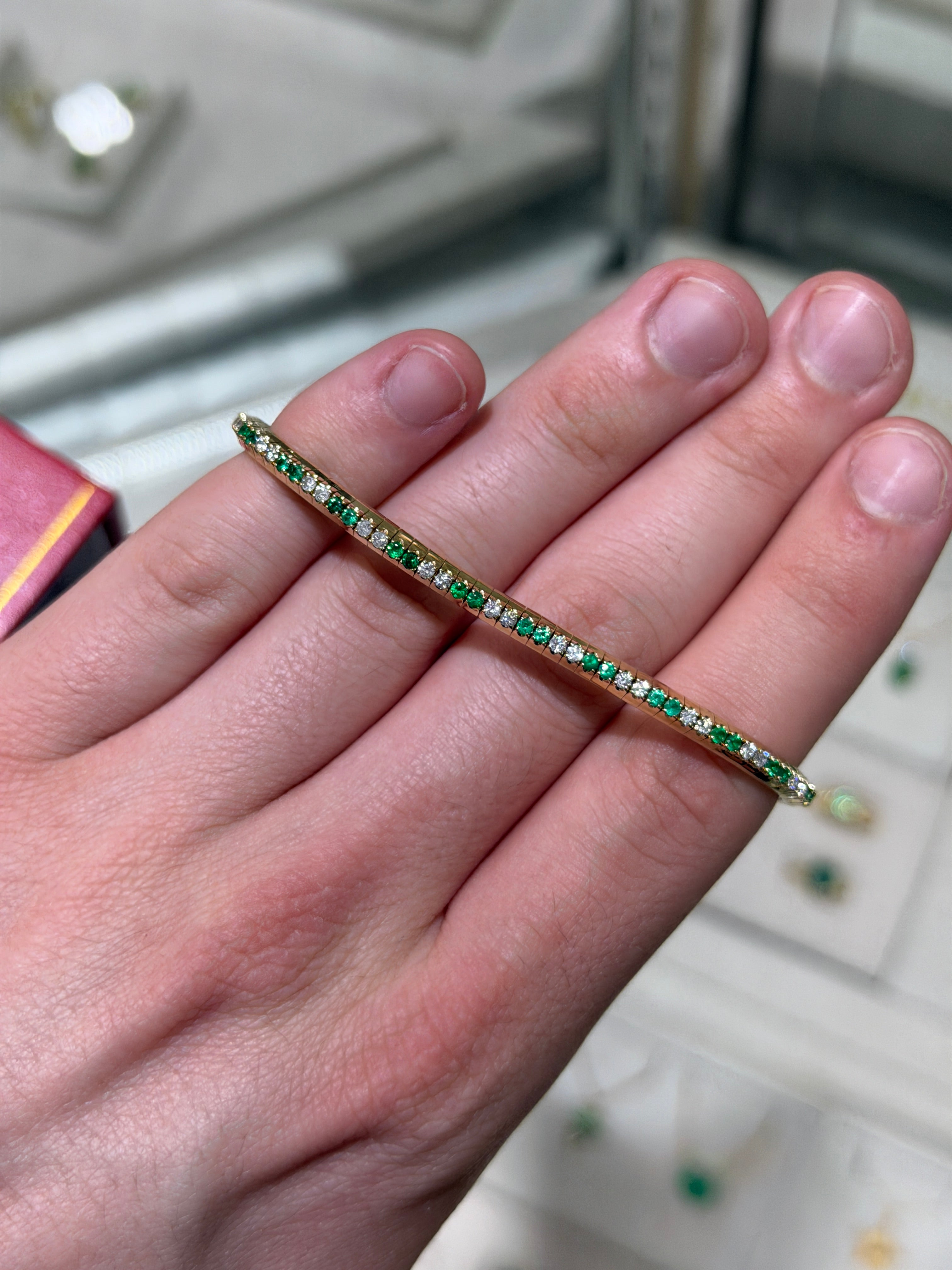 14K gold tennis bracelet with alternating natural emeralds and diamonds, prong-set, stretchy design by JR Colombian Emeralds.