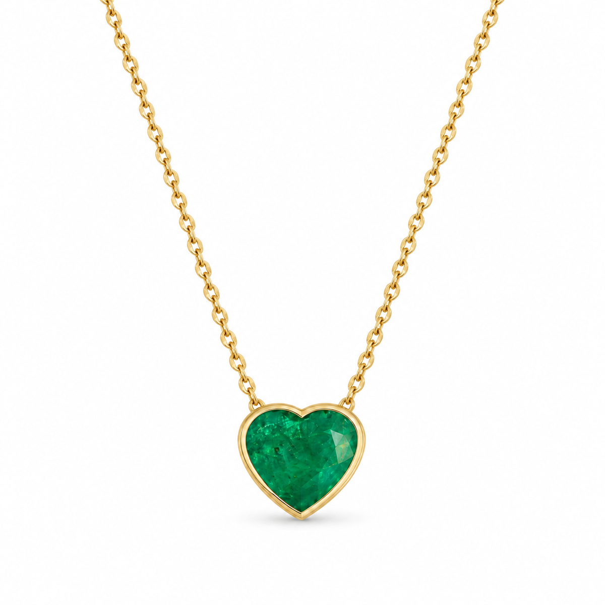 18K Colombian emerald heart cut solitaire bezel necklace by JR Colombian Emeralds, showcasing a vibrant 2.98ct green gemstone.