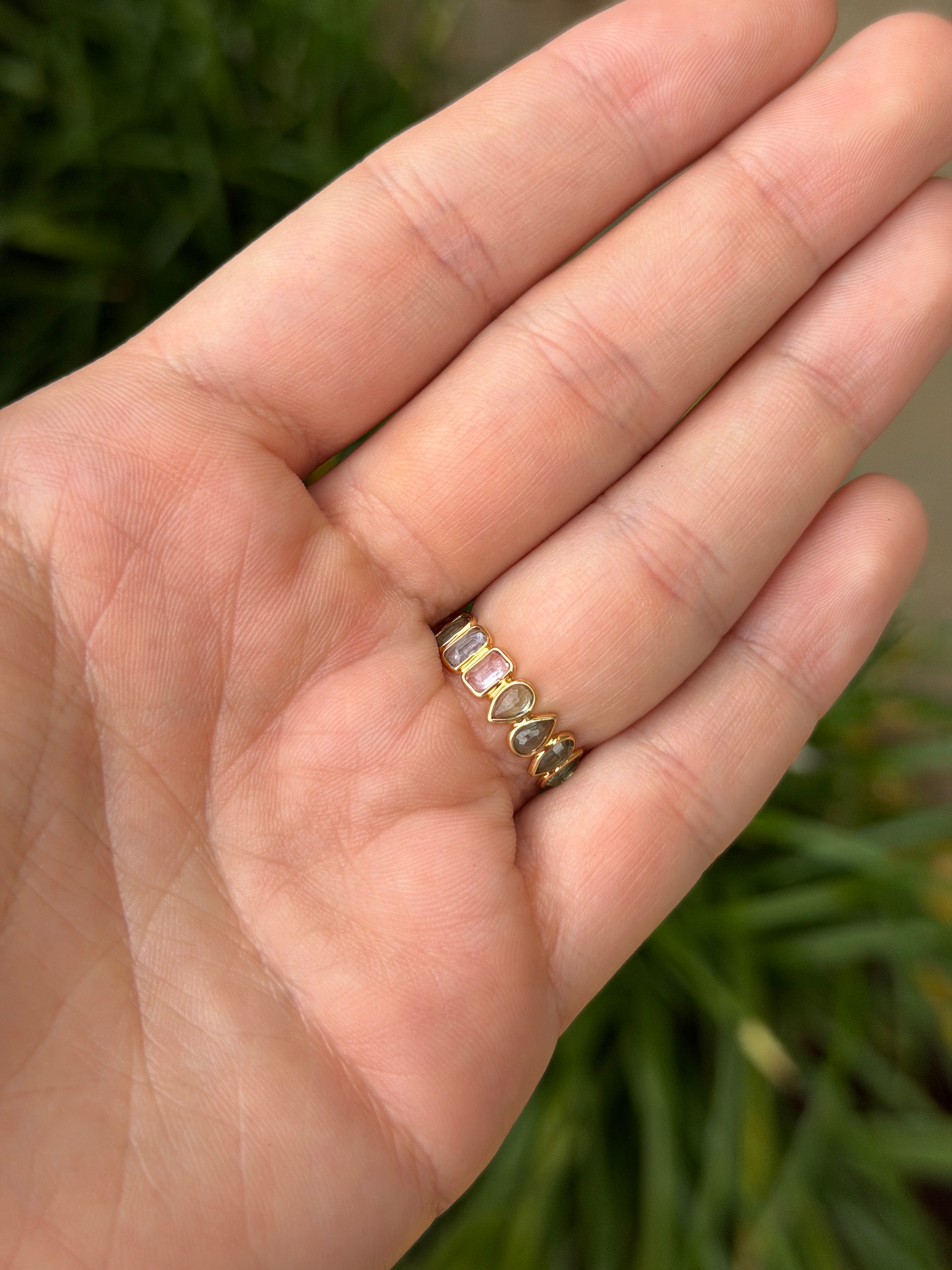 18K gold eternity band with 2.03tcw pastel rainbow sapphires and inverted sapphires, low profile design, size 6.5, by JR Colombian Emeralds.