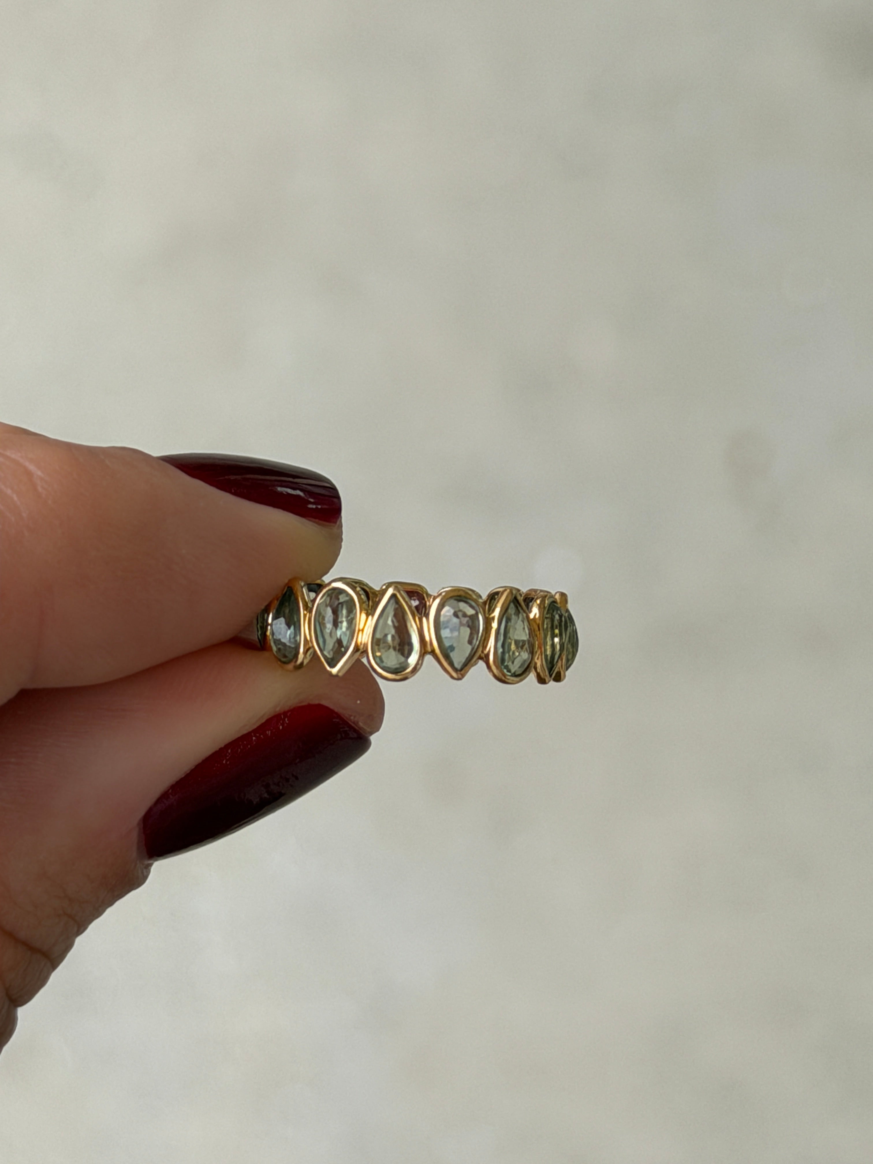 18K gold rainbow sapphire eternity band with pastel sapphires, low profile, size 6.5, featuring inverted sapphire setting by JR Colombian Emeralds.