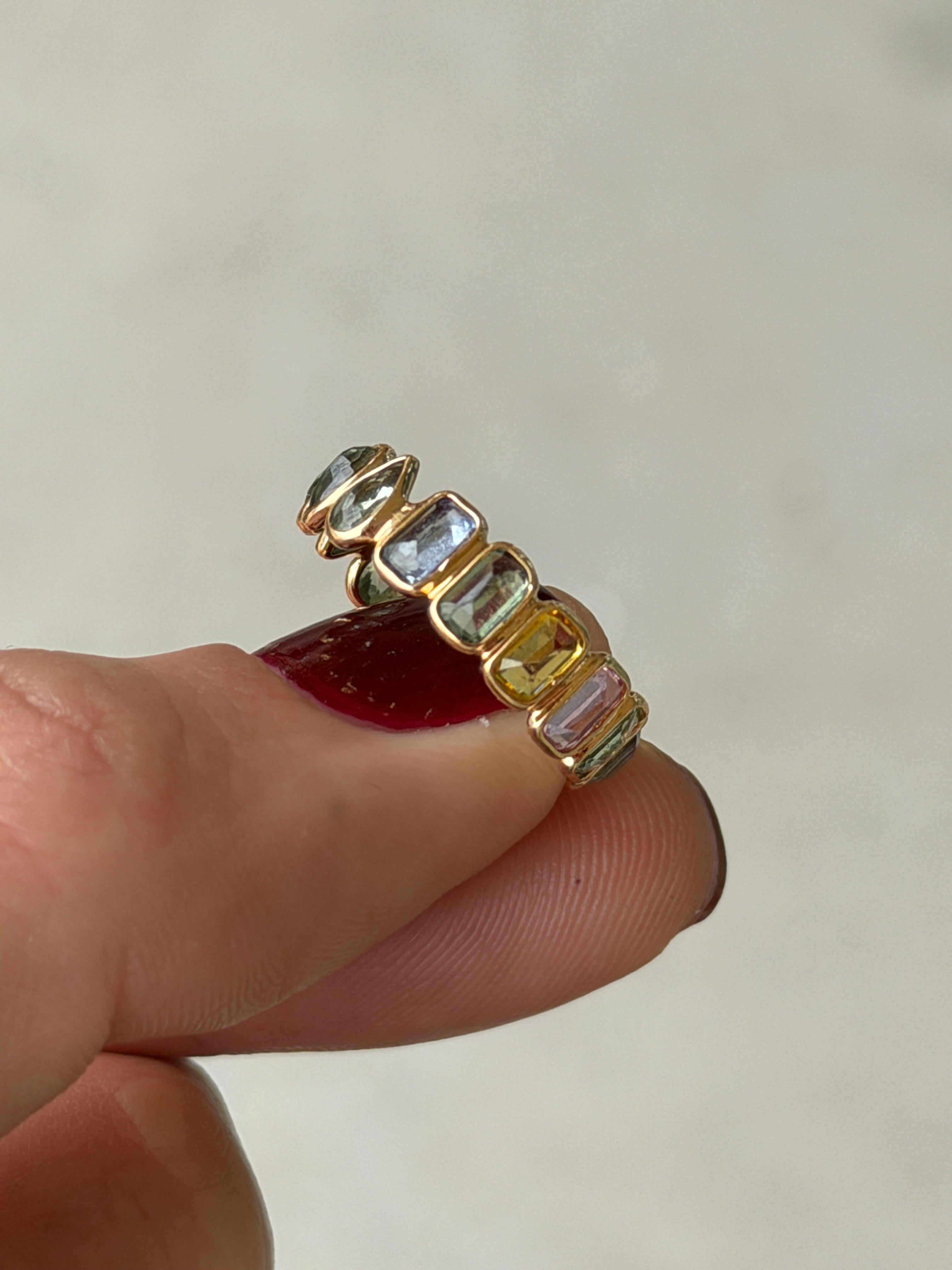 18K gold rainbow sapphire eternity band with pastel sapphires, inverted design, low profile, size 6.5 from JR Colombian Emeralds