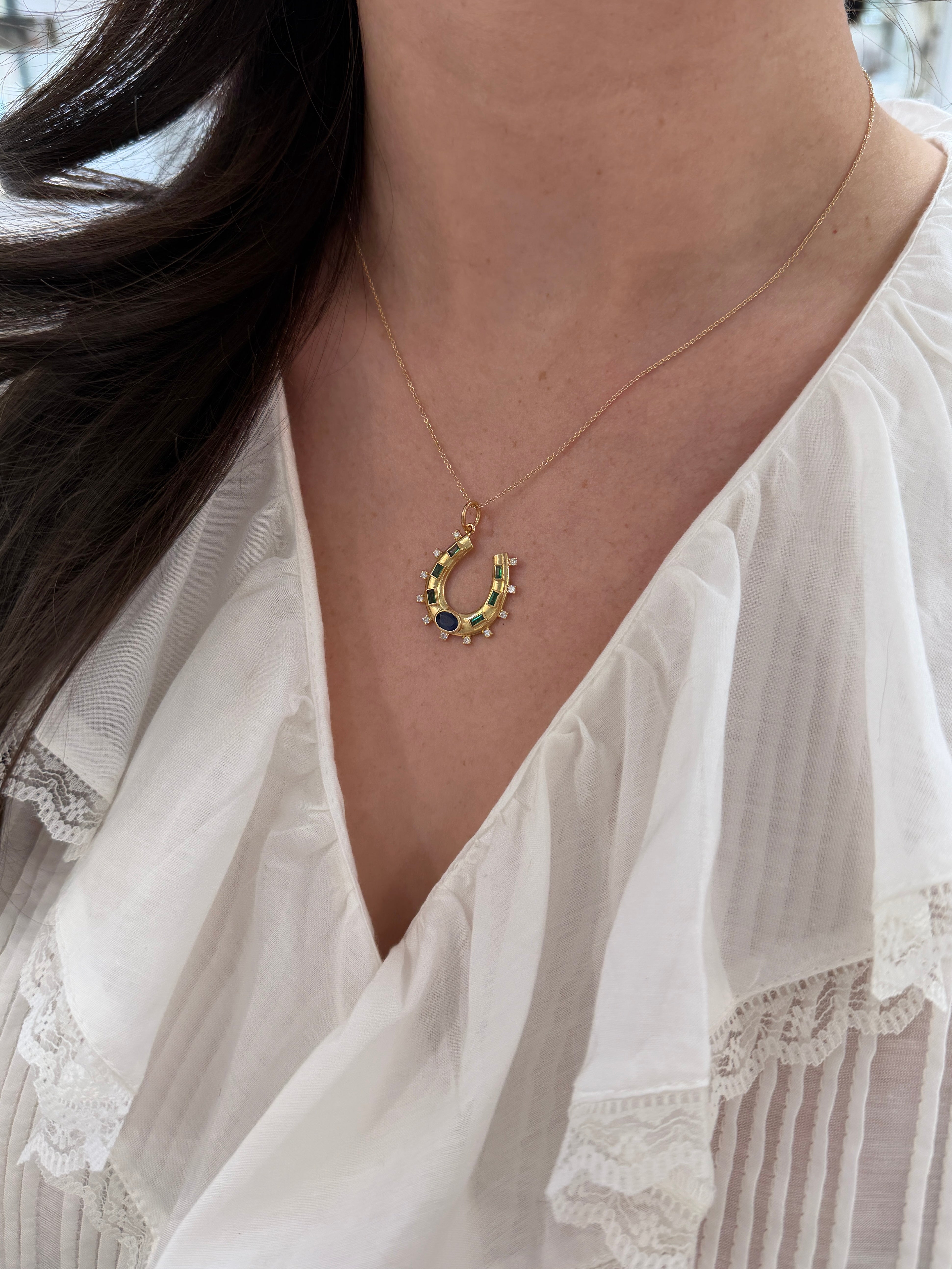 14K gold horseshoe charm pendant with 1.26tcw natural sapphires, emeralds, and diamonds by JR Colombian Emeralds.