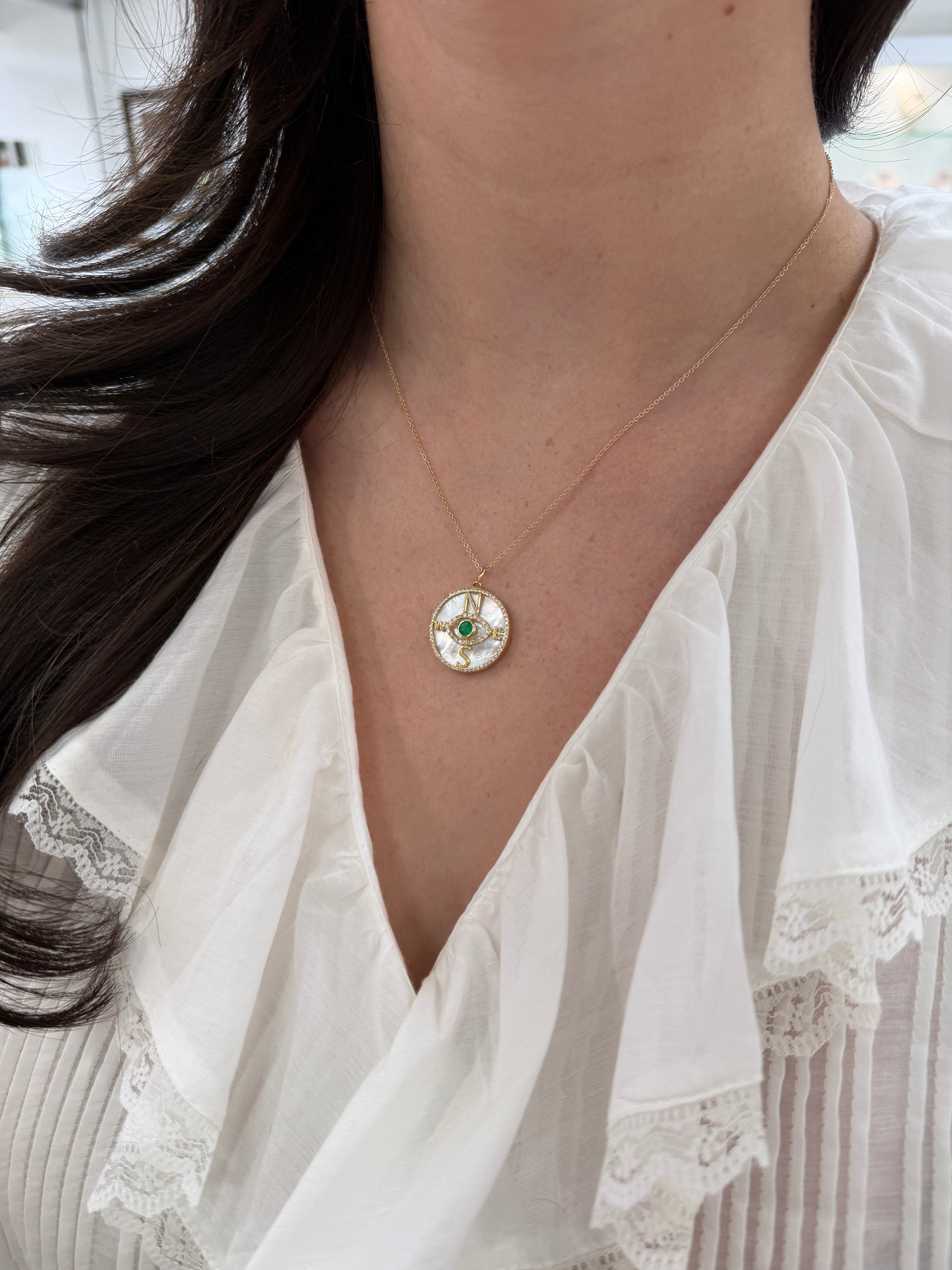 14K gold emerald and diamond compass evil eye pendant necklace featuring mother of pearl, by JR Colombian Emeralds.