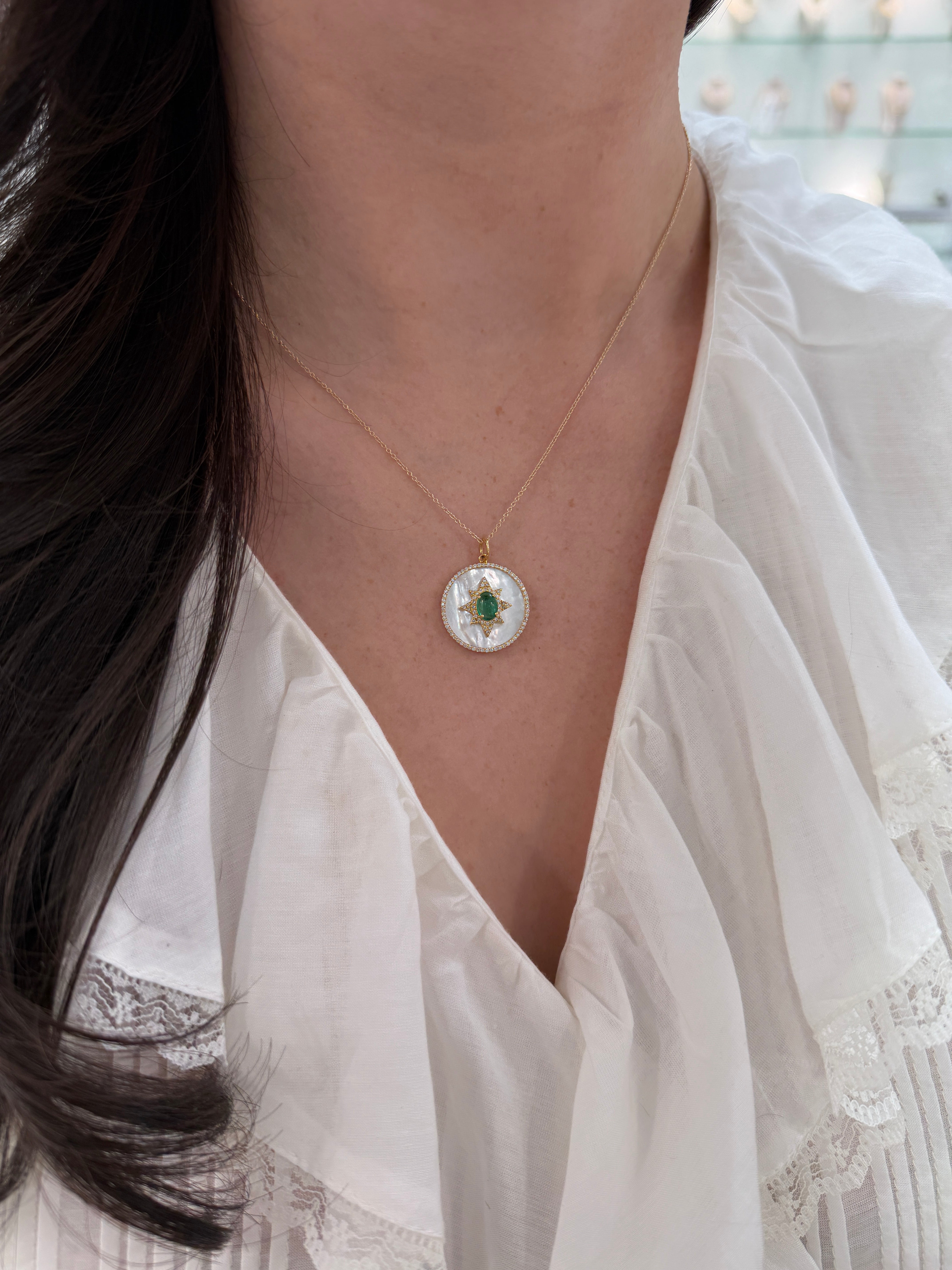 14K gold starburst medallion with emerald cabochon, mother of pearl, and diamond halo, jewelry piece by JR Colombian Emeralds.