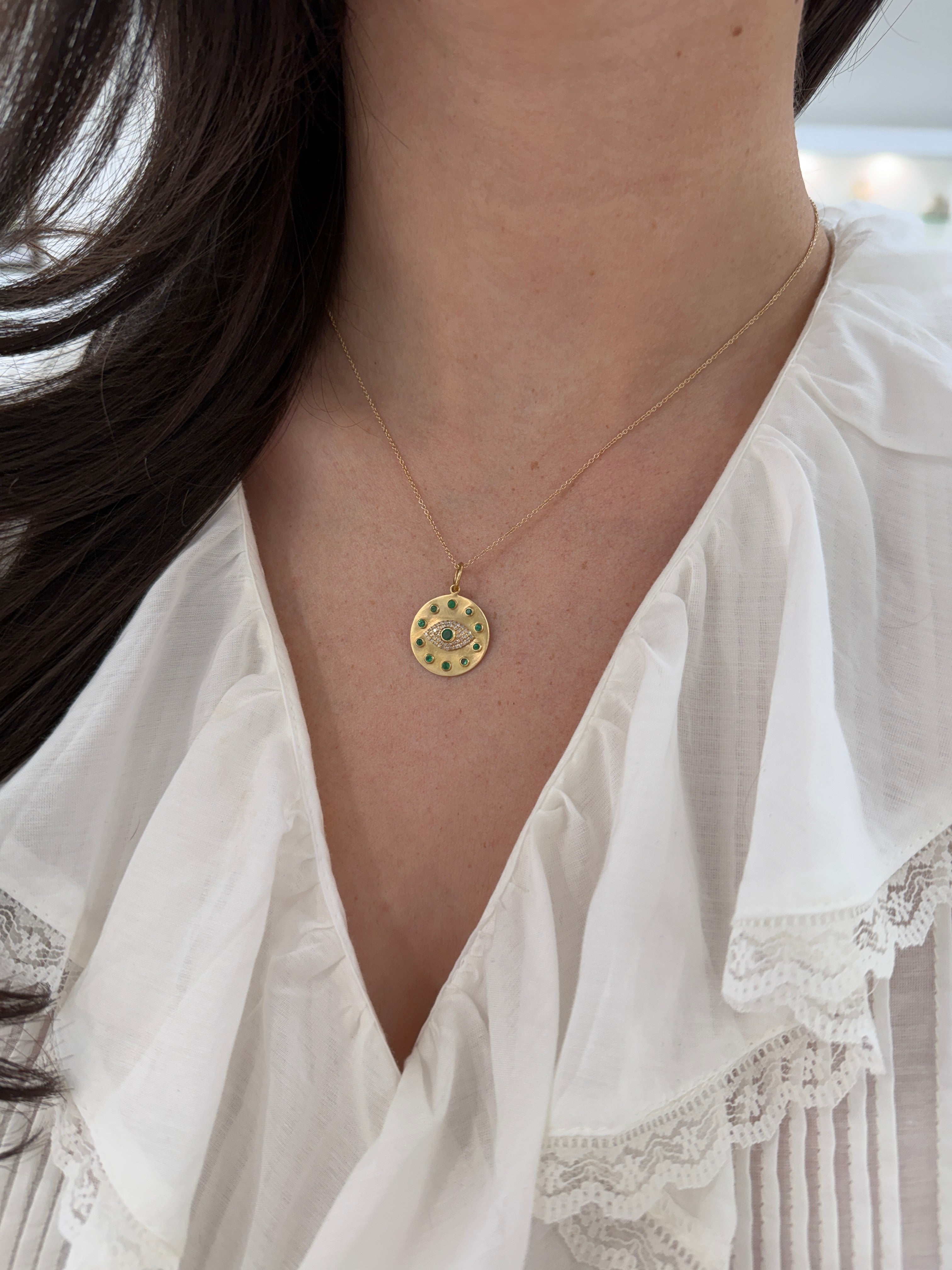14K gold evil eye pendant with natural emerald and diamond accents, designed for protection, by JR Colombian Emeralds.