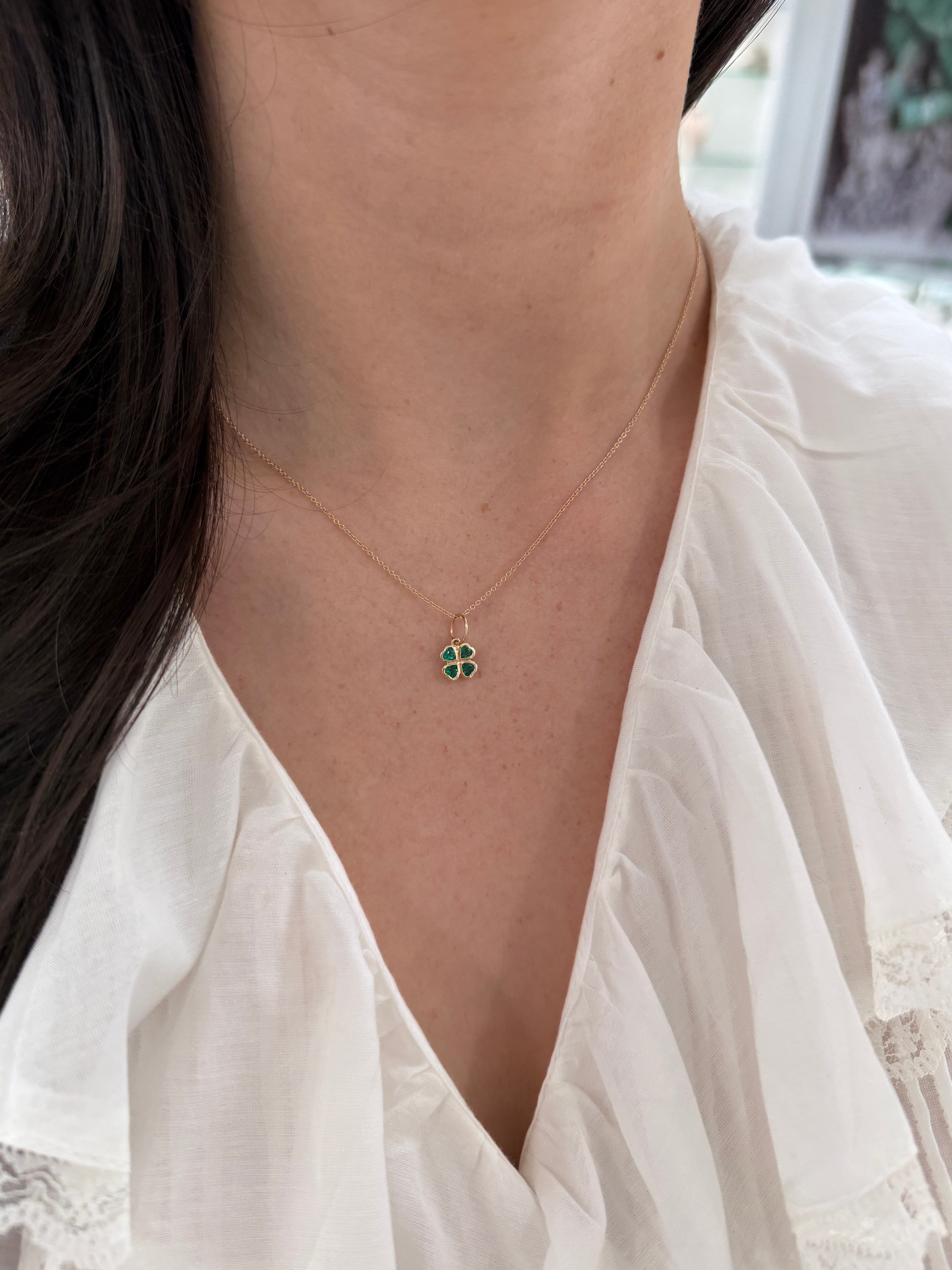 14K gold heart cut emerald clover charm pendant with 0.44tcw, featuring AAA+ quality emeralds by JR Colombian Emeralds.