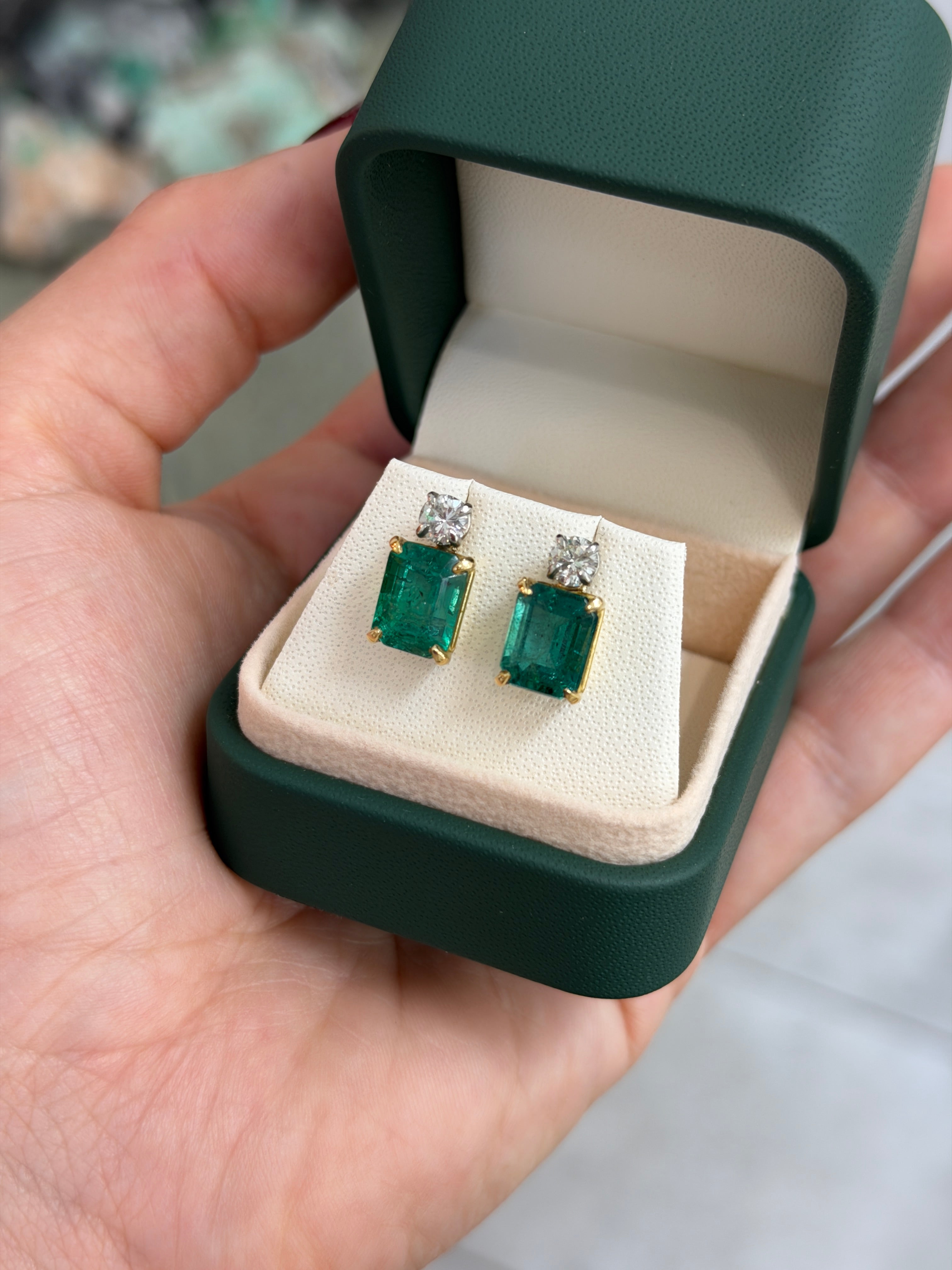 Colombian Emerald 18K two-tone earrings featuring vivid blue-green natural emerald-cut and round diamonds in a stud design.