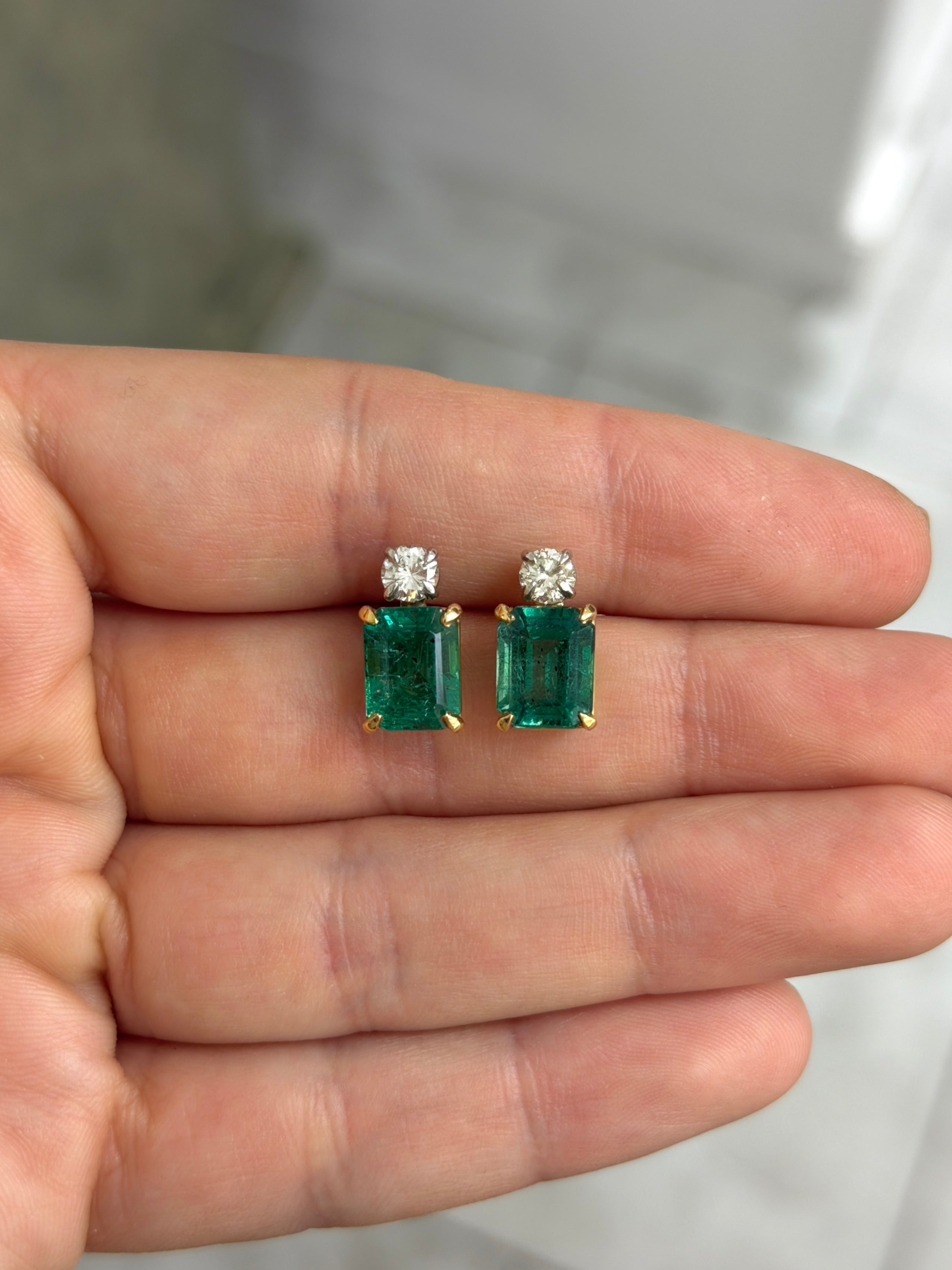 Colombian Emerald natural diamond stud earrings with vivid sea green-blue emerald-cut and round diamonds, 18K two-tone gold.